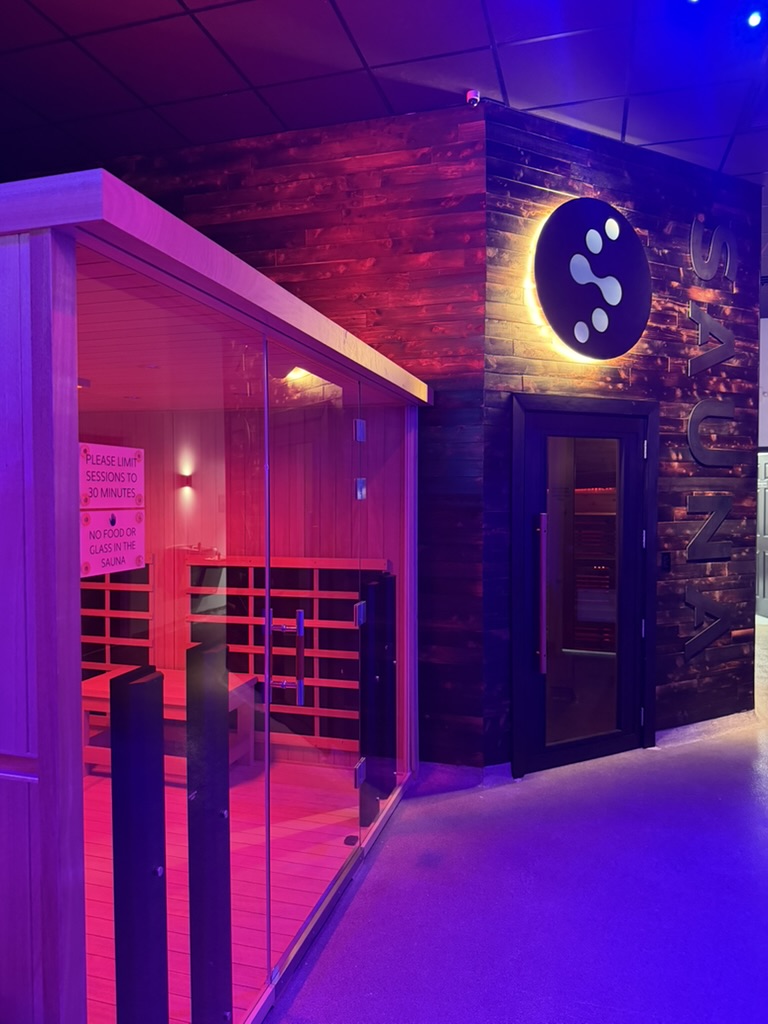 Norwegian sauna entrance with Evolve logo sign