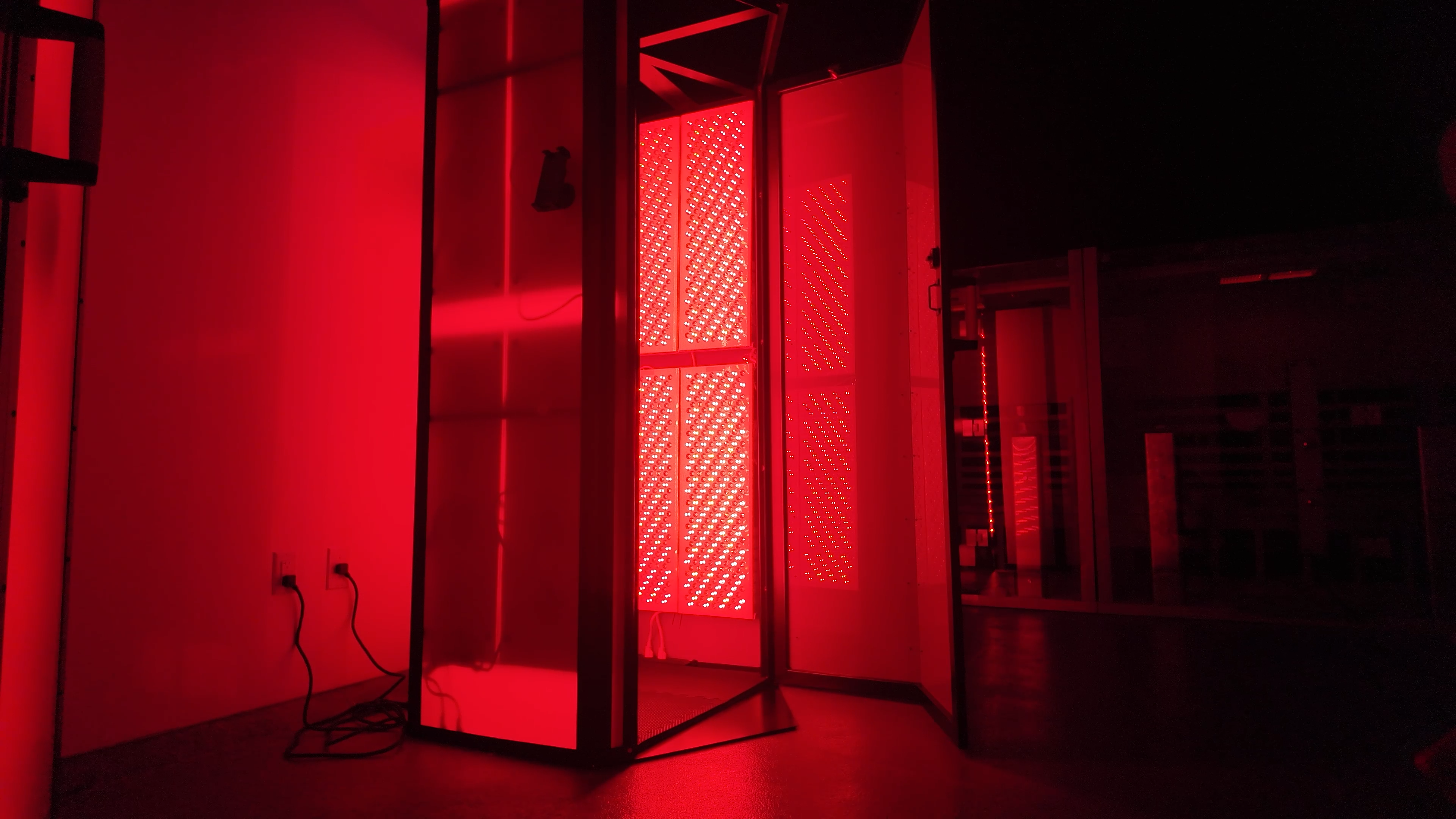 Full-body red light therapy booth ready for use at Evolve Round Rock