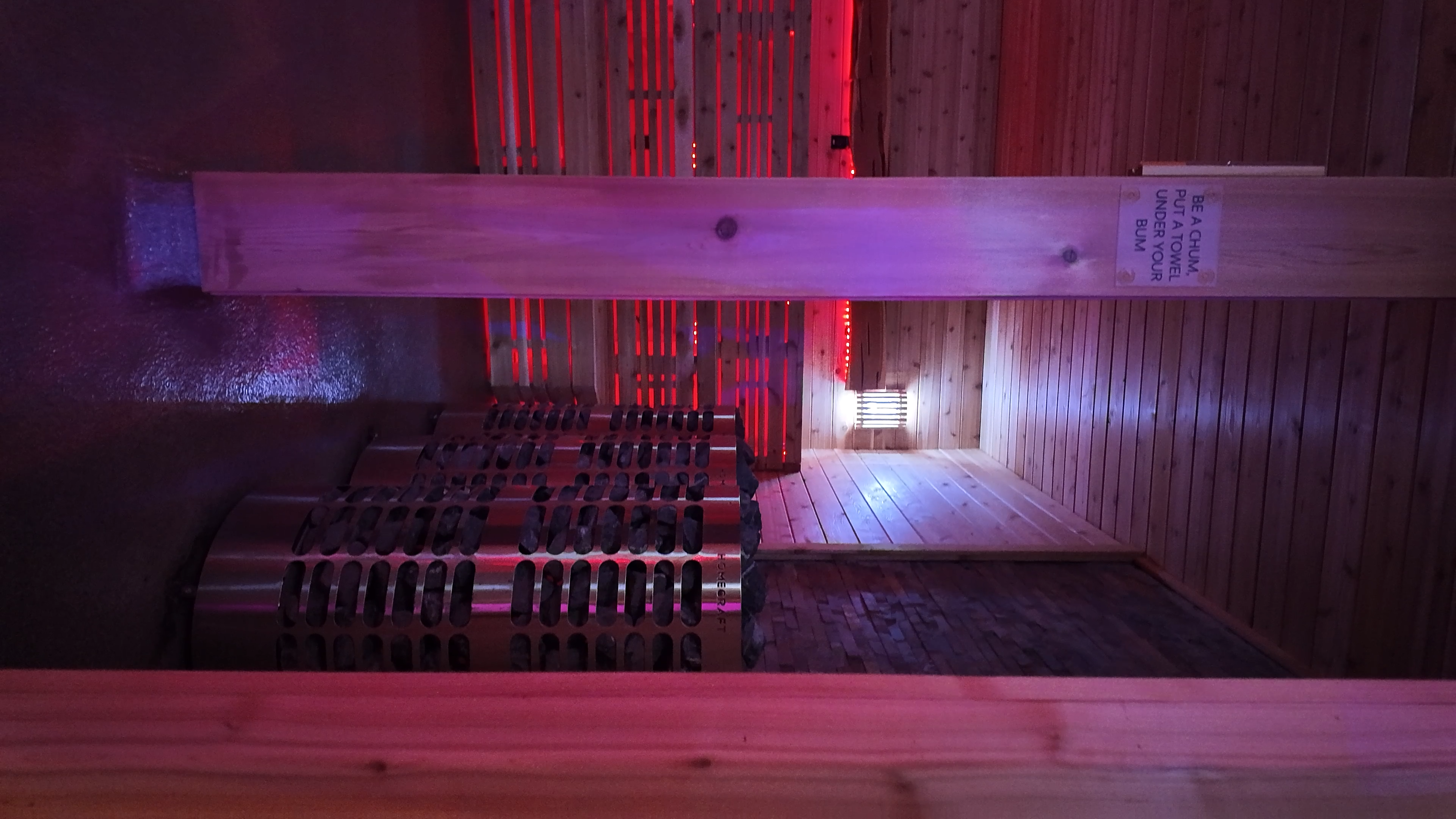 Infrared sauna heater and bench view at Evolve