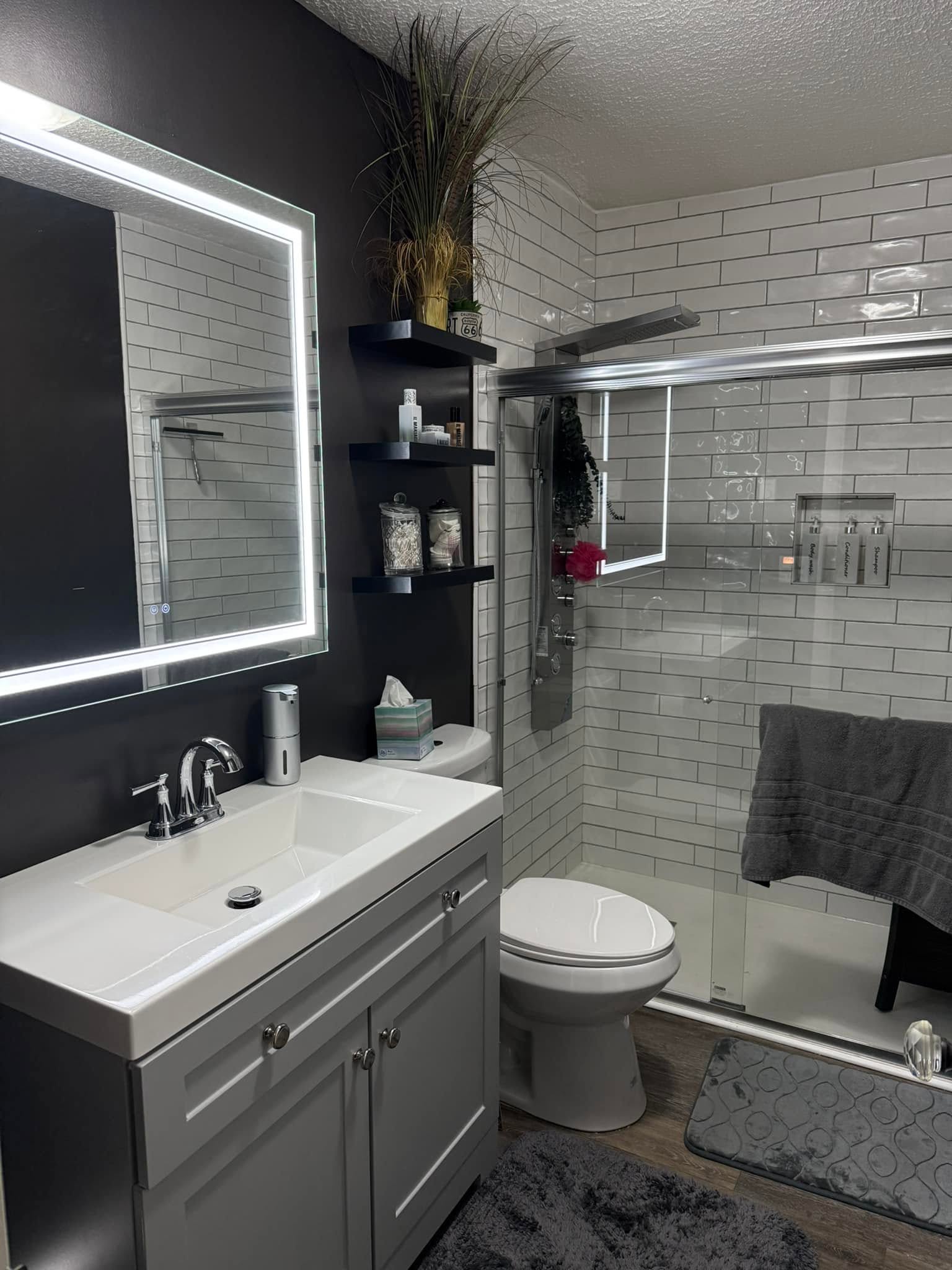 Remodeled bathroom with subway tile shower