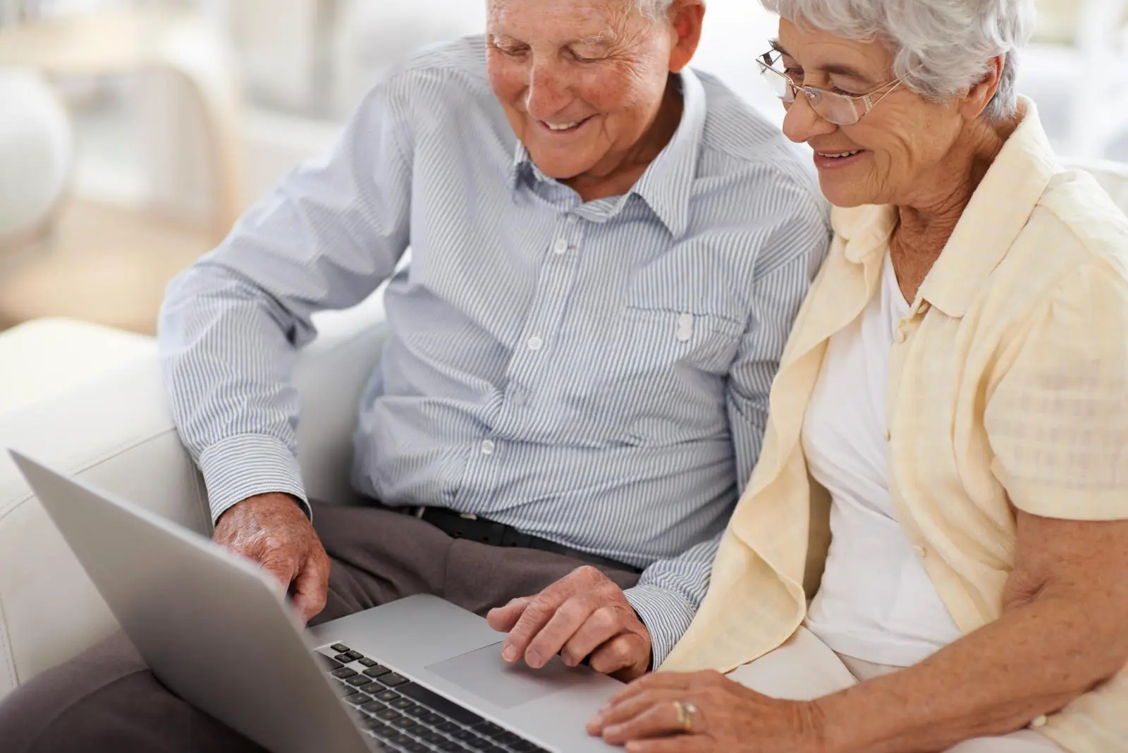 two elders using the laptop