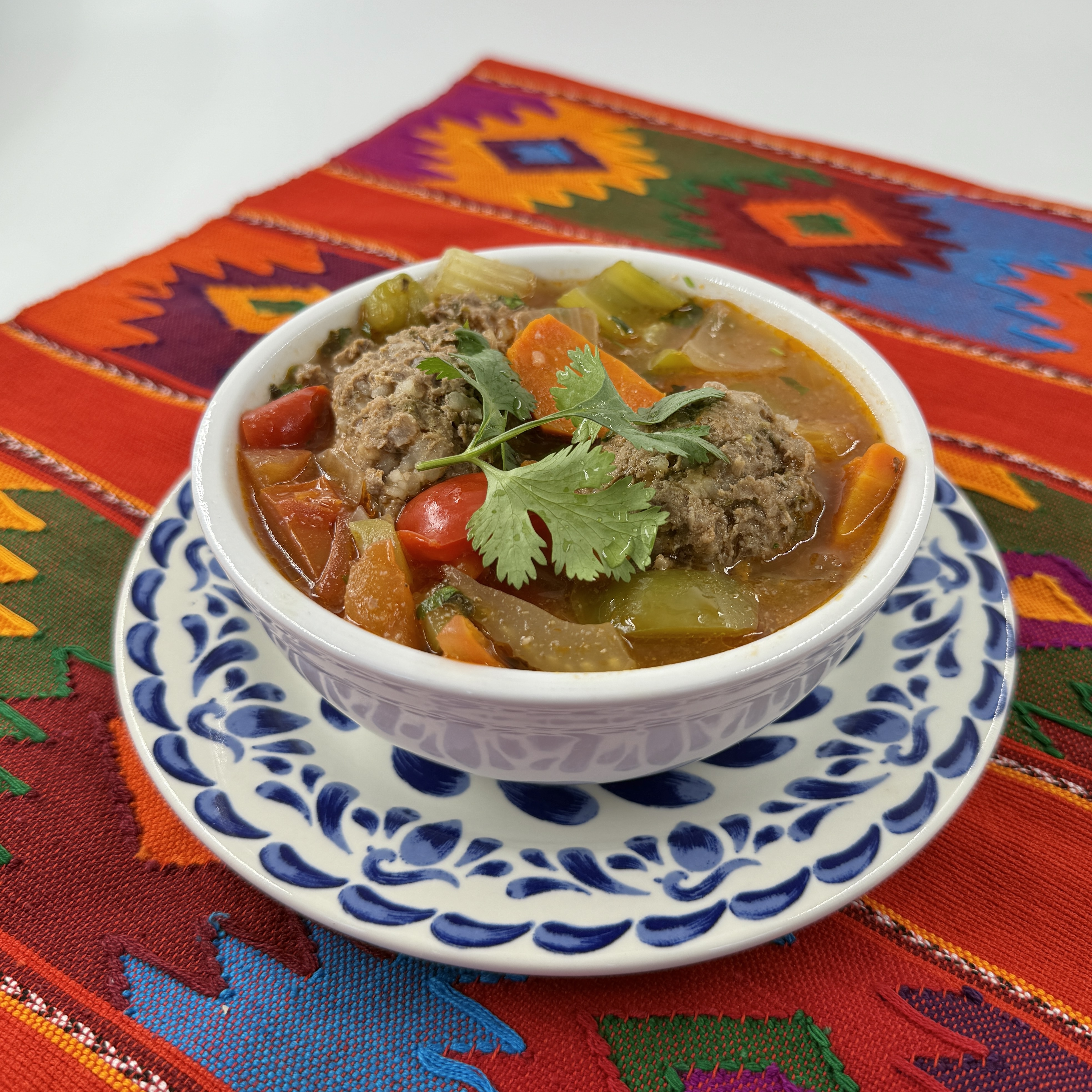 Albondigas Soup at Casa de Pico: hand-rolled beef meatballs and chopped vegetables in a savory broth, garnished with fresh cilantro