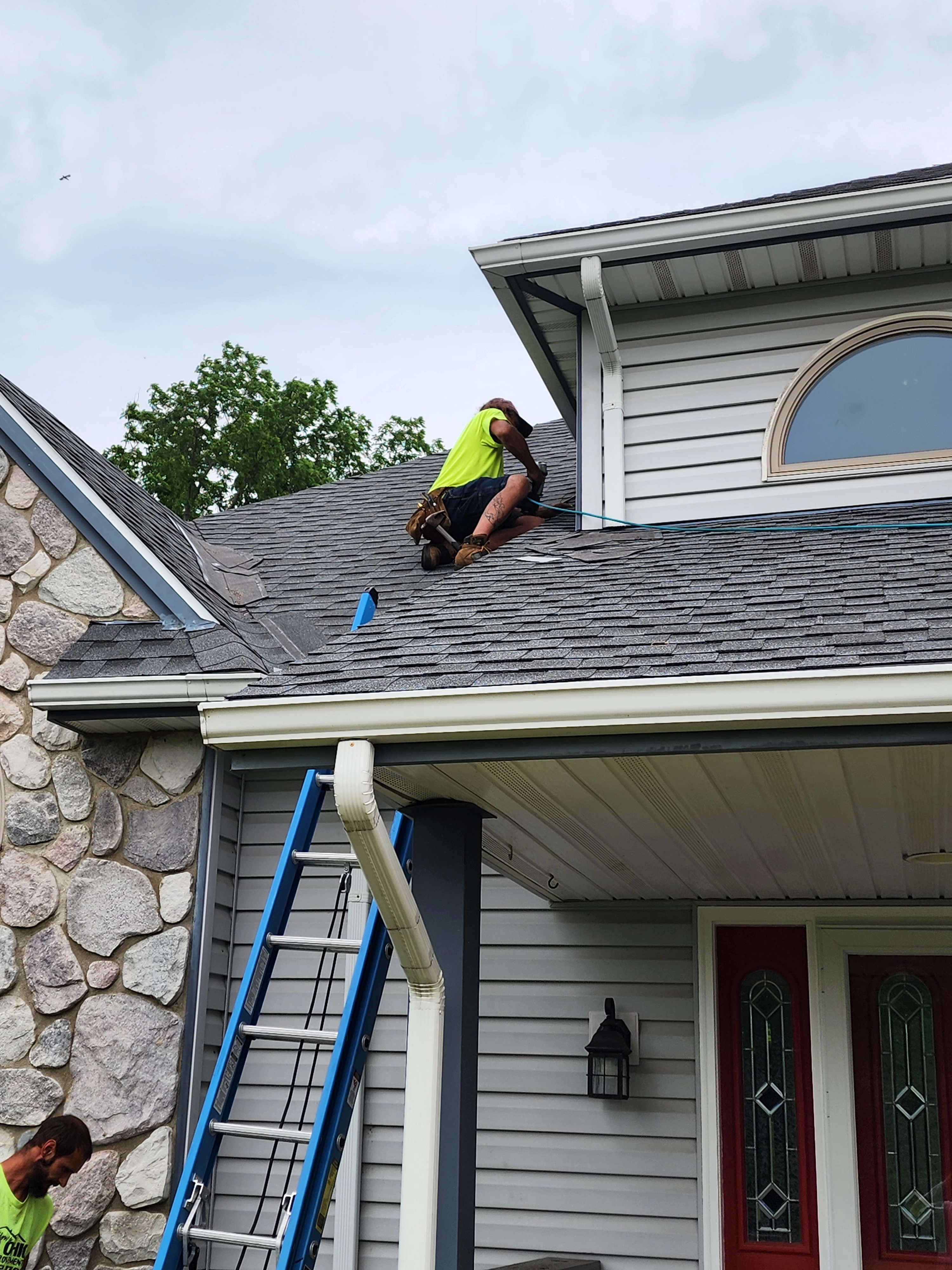 A Weikles Roofing team member on a roof performing maintenance. A Weikles Roofing team member on a roof performing maintenance.