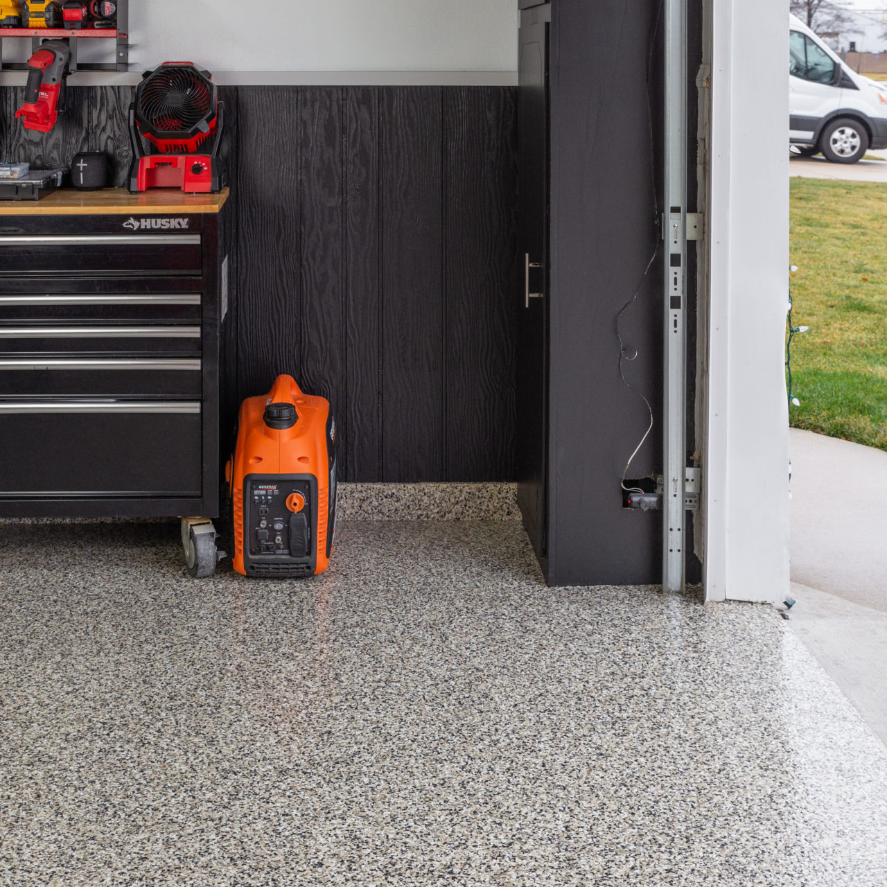Garage with full chip flooring system, showcasing durable and decorative VistaPro coating solution