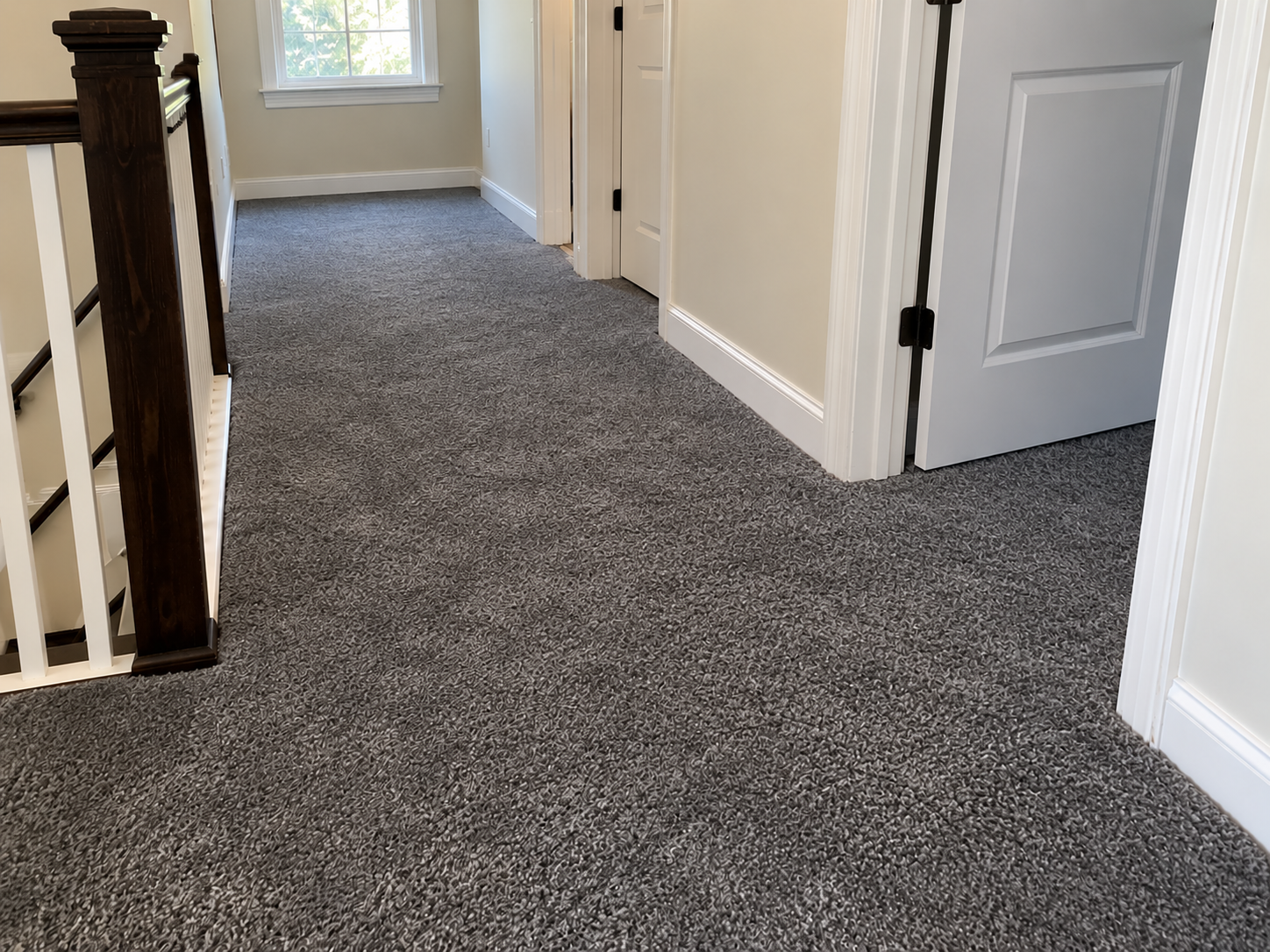 After: the same hallway carpet re-installed flat and smooth through the doorway