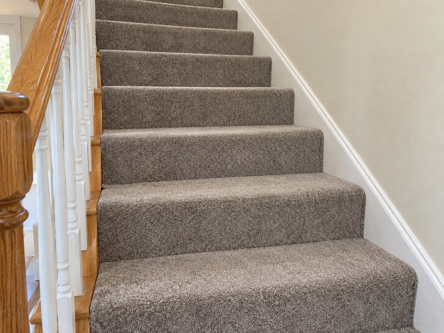 After: the same staircase carpet re-stretched tight and flat over every step
