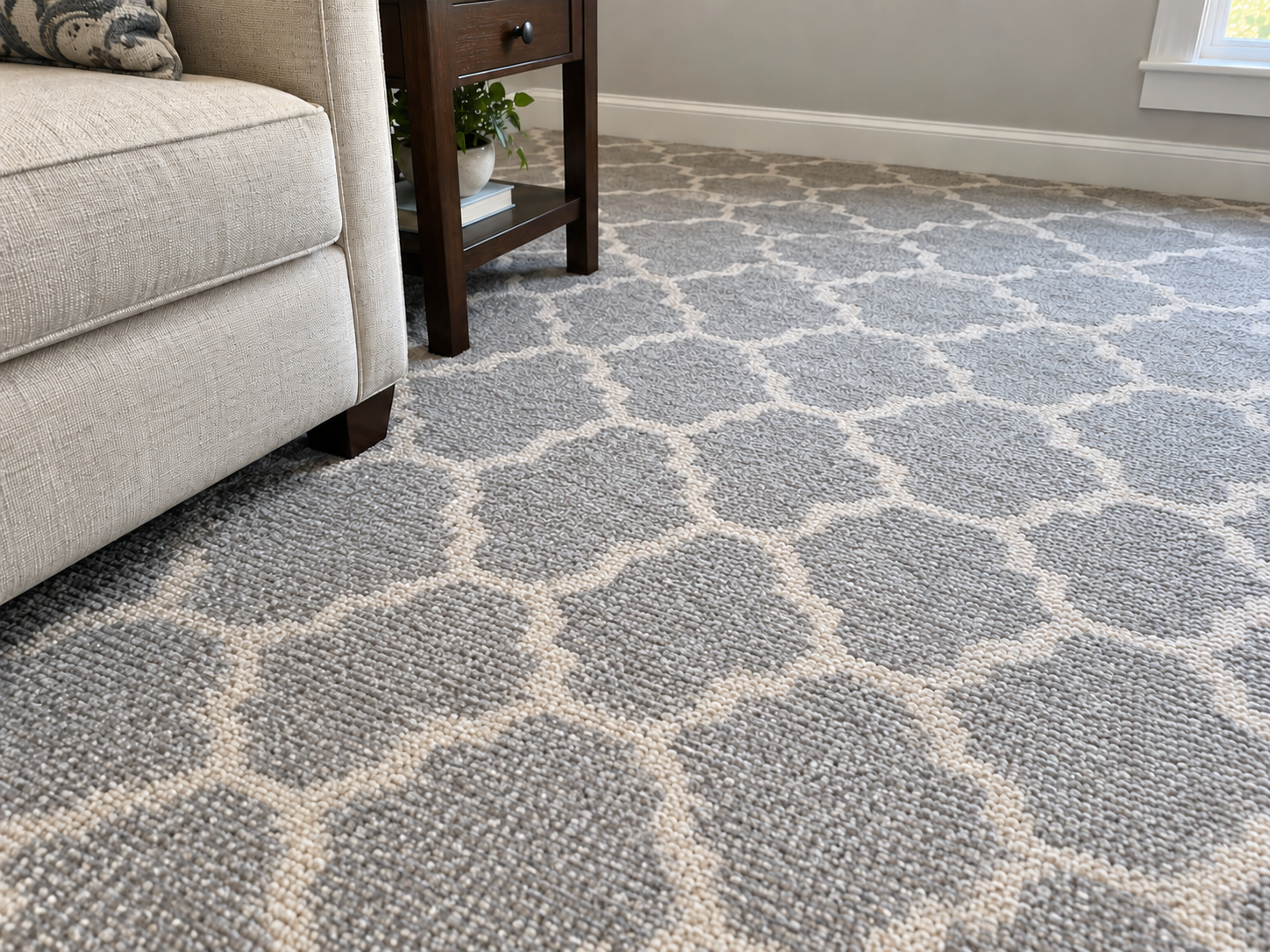 After: the same patterned carpet with the stain fully removed and the gray and cream pattern restored