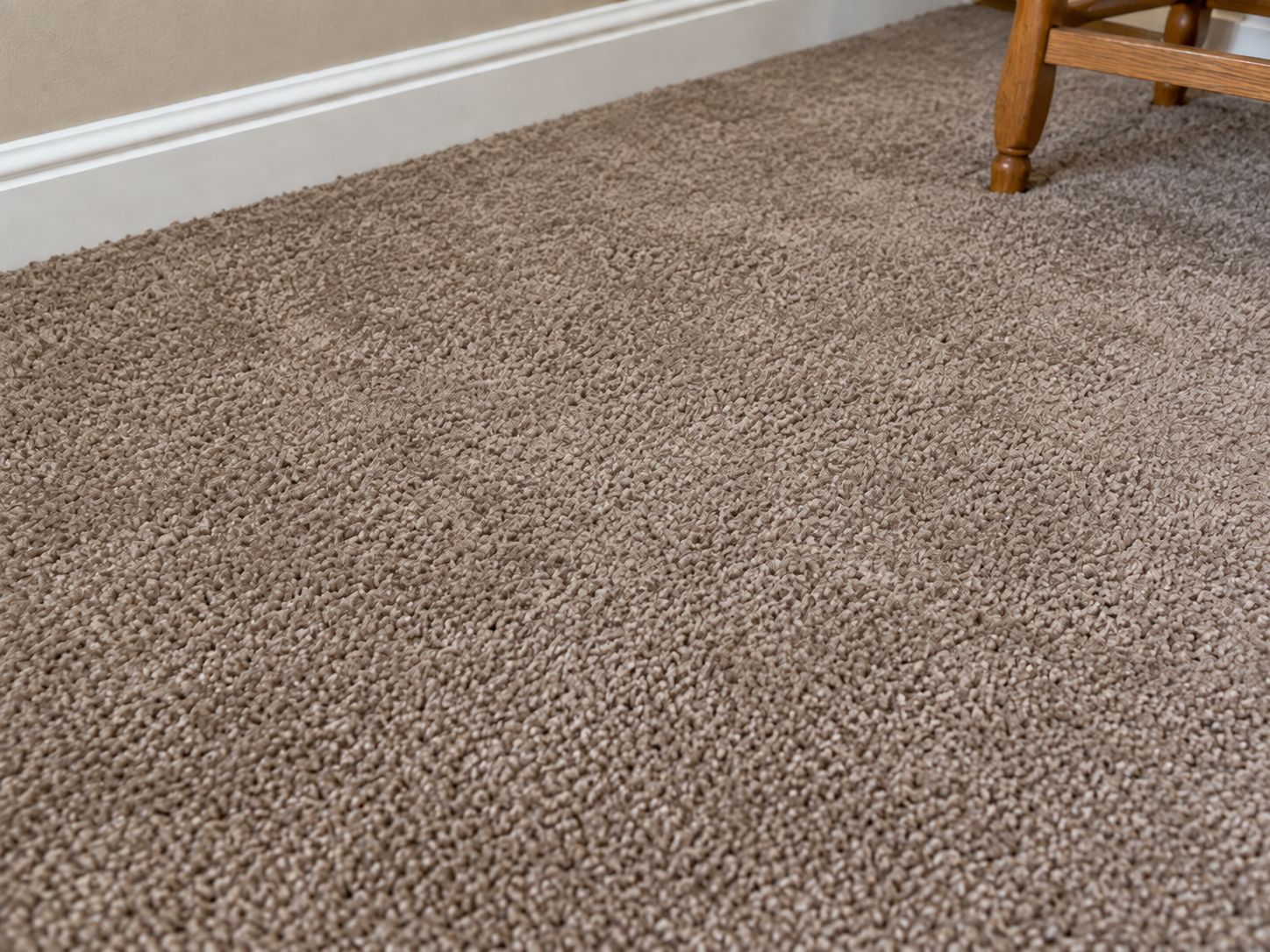 After: the same taupe carpet color-blended so the faded patch matches the surrounding fiber