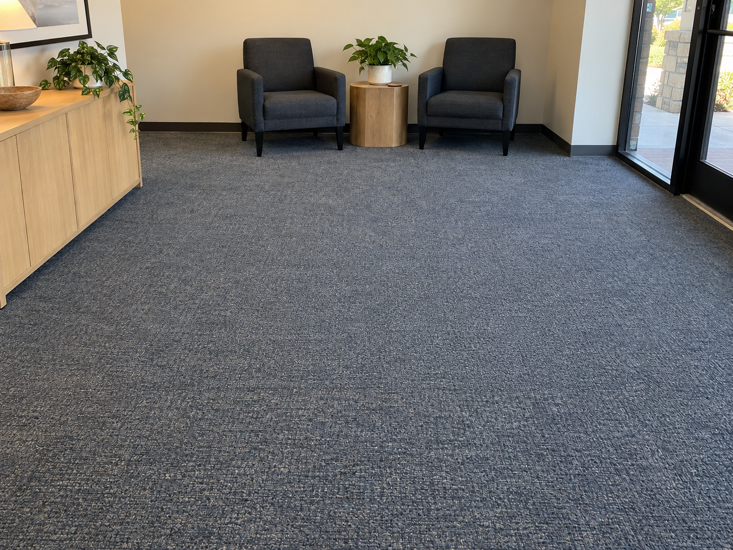 After: the same lobby carpet color-blended to one uniform blue-gray tone
