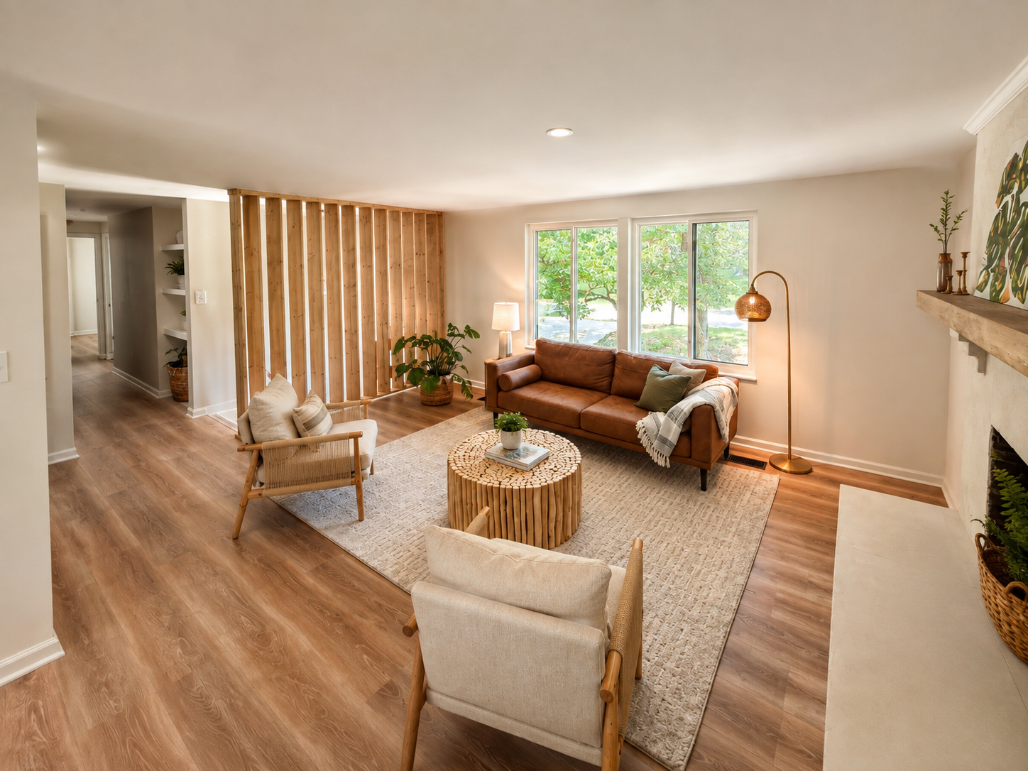 Design-build team and homeowner coordinating plans and materials around a conference table