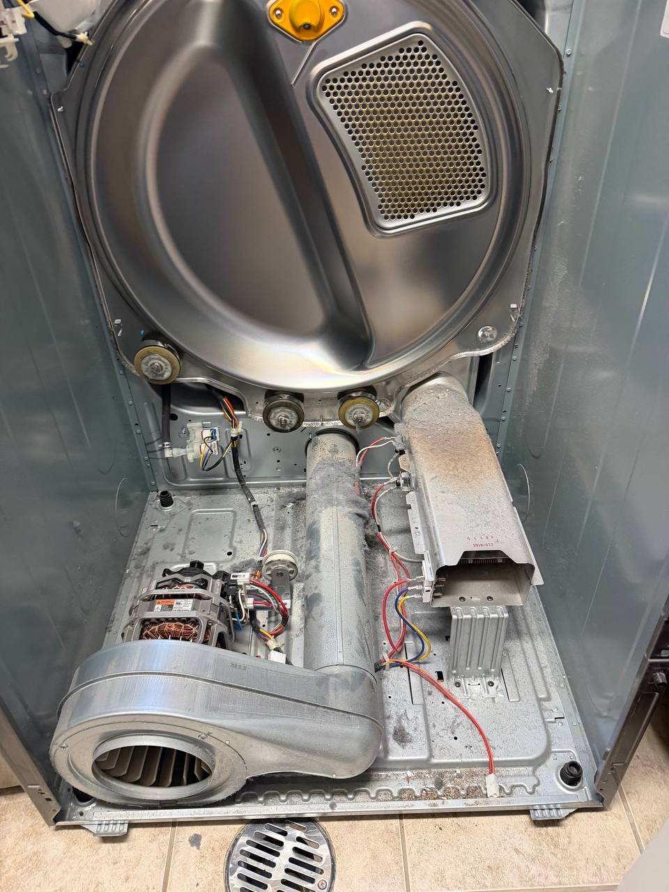 Dryer drum and motor inspection with door open — Denver metro