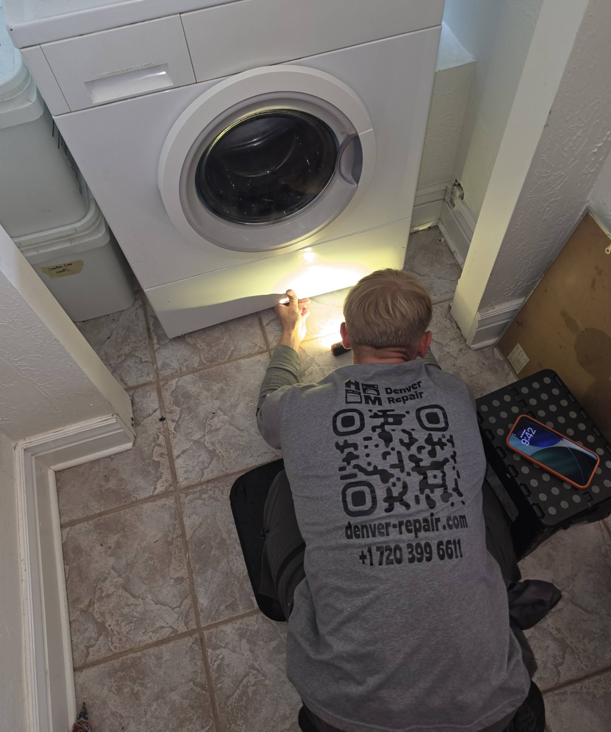 Gena inspecting a washing machine — Denver metro