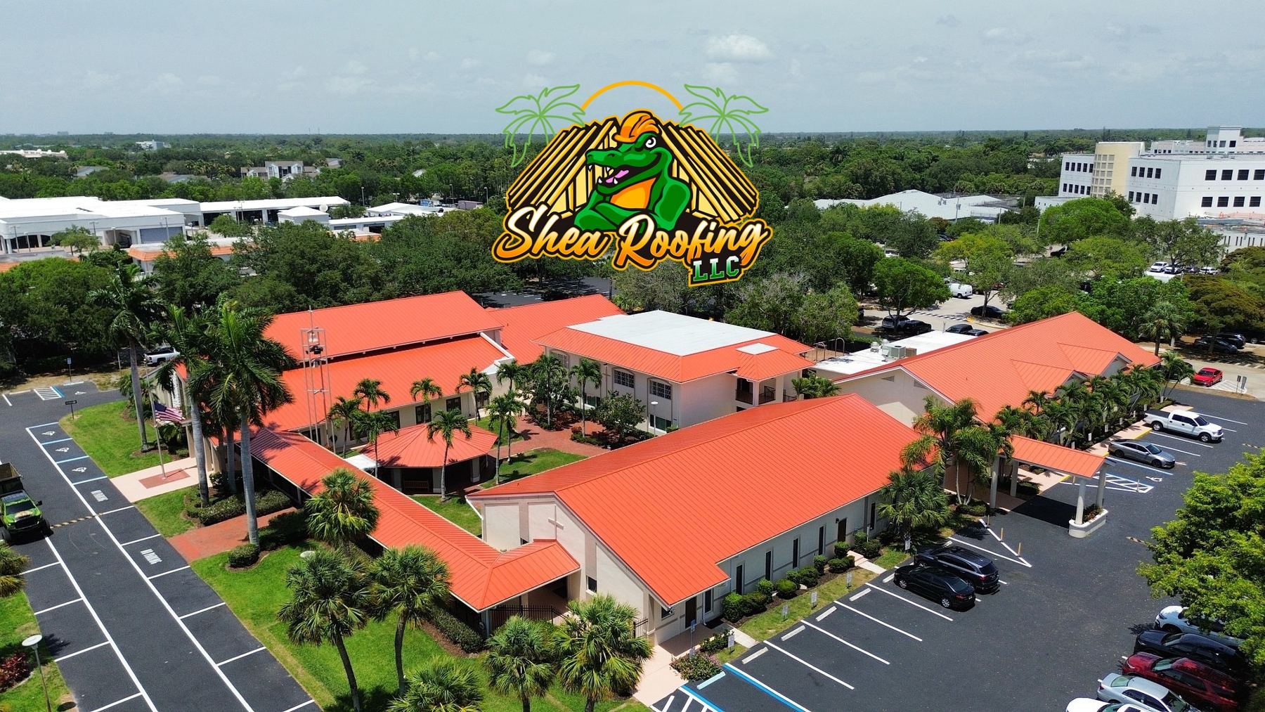 Commercial complex with tile roofs, aerial view