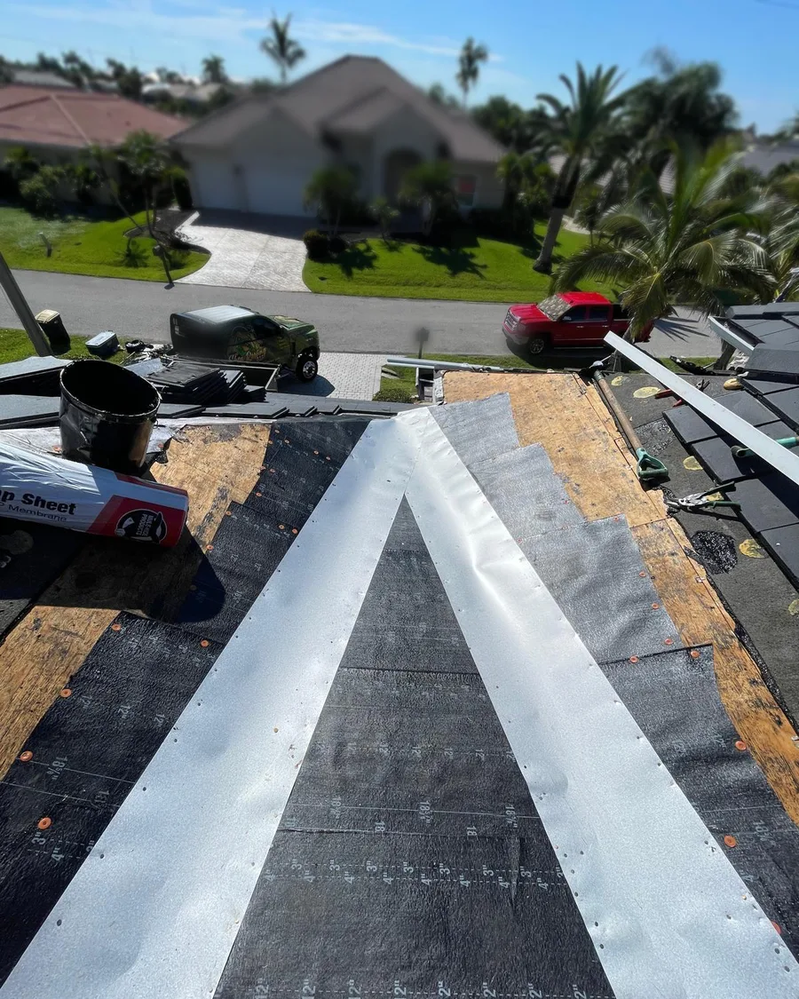 Shea Roofing roof repair: new valley metal and underlayment installed