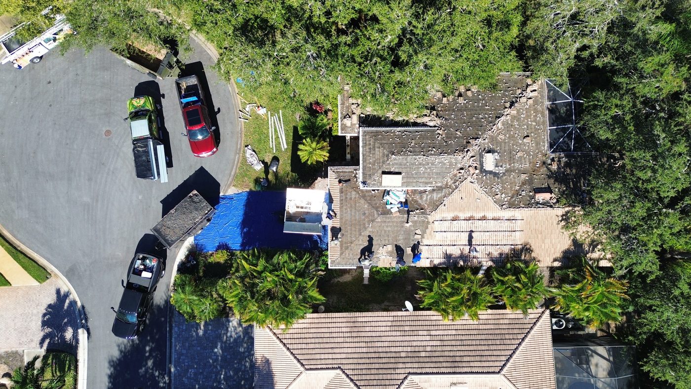 Aerial view of a Punta Gorda Isles home during roof tear-off