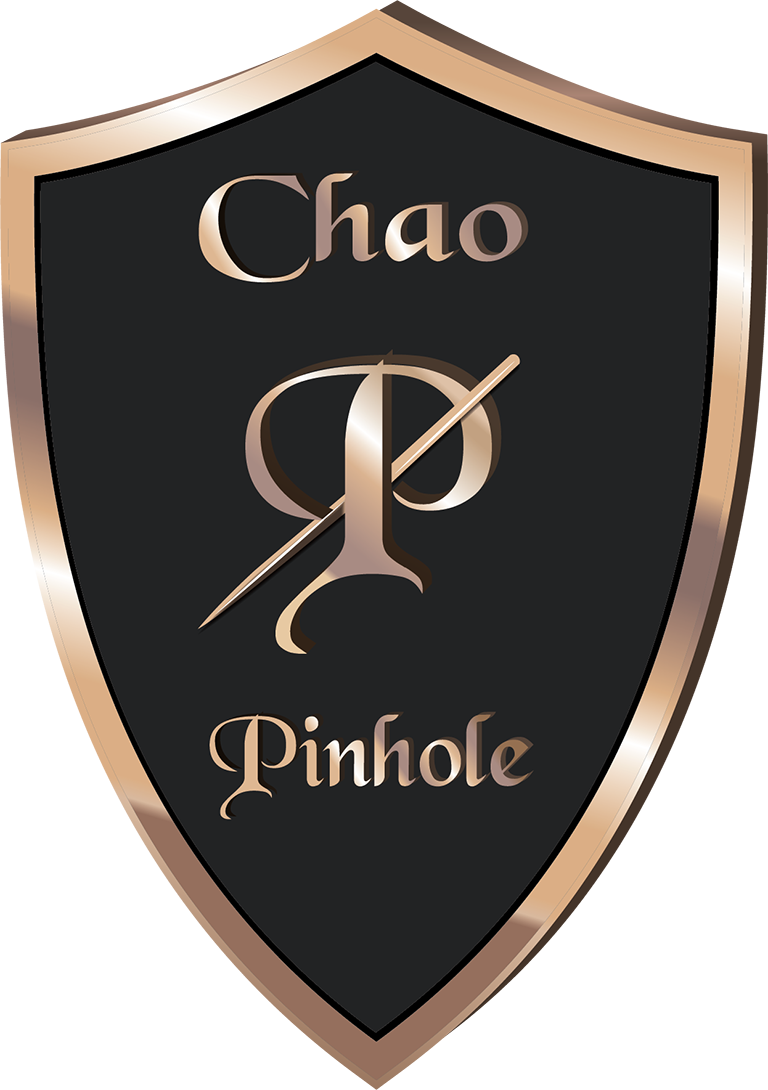 Logo Chao Pinhole Surgical Technique Shield black with gold outline with a old english P with the word Chao above and Pinhole below