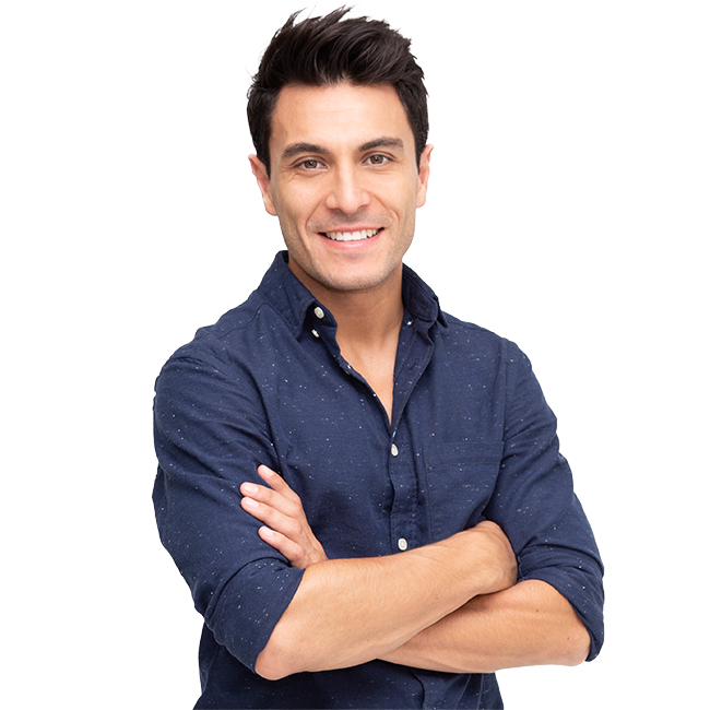 Happy Italian man with short dark hair standing with his arms crossed and a smile on his face showing teeth in a blue shirt with shit flecks.