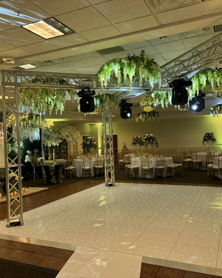 Wedding dance floor with LED starlit floor and floral truss