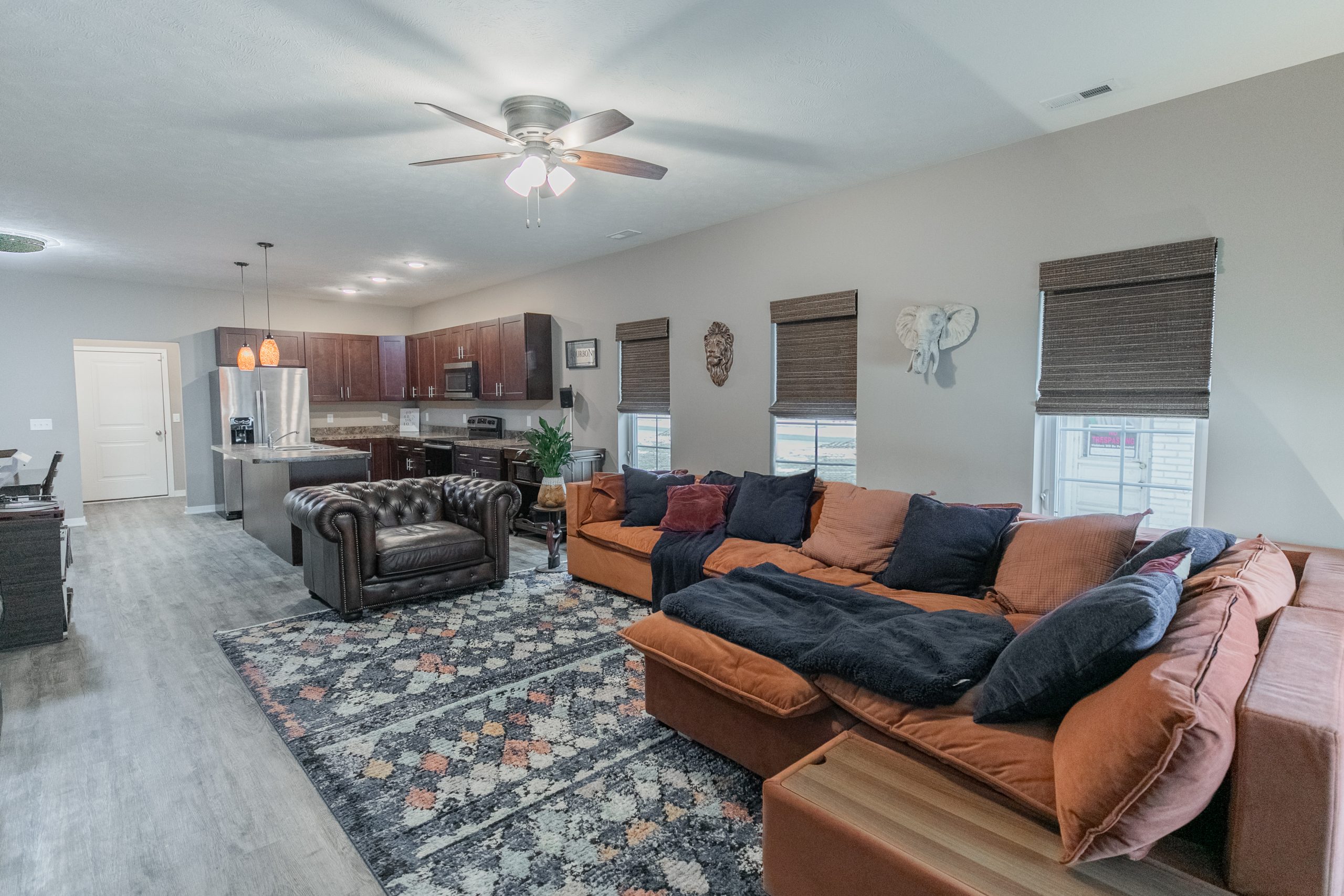 Open living space with leather seating and open kitchen
