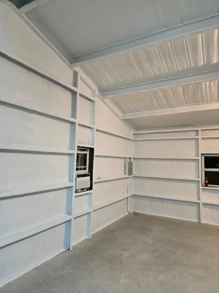 Metal building interior with closed-cell spray foam insulation by 903 Spray Foam in Sumner, TX