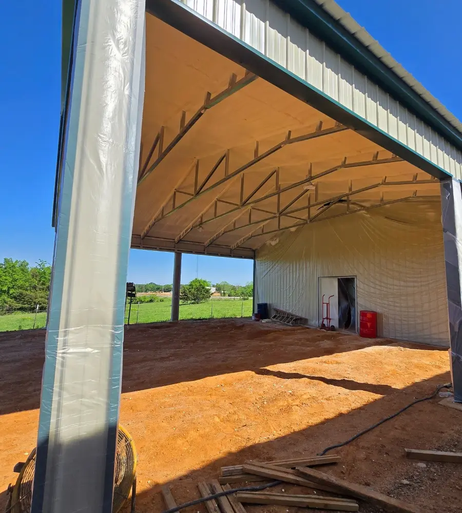 Closed-cell spray foam reinforcing metal building interior for added structural support in Sumner, TX by 903 Spray Foam