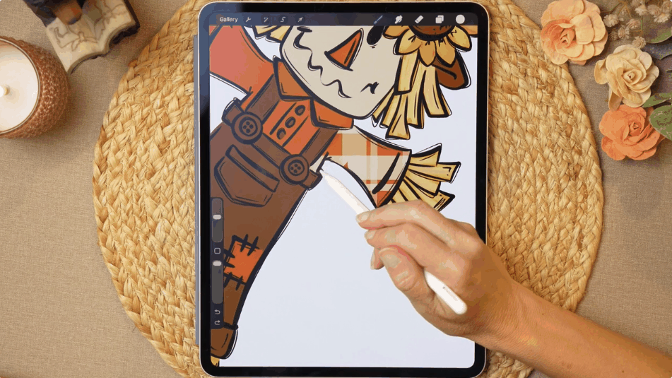 Coloring the scarecrow with a plaid brush in Procreate