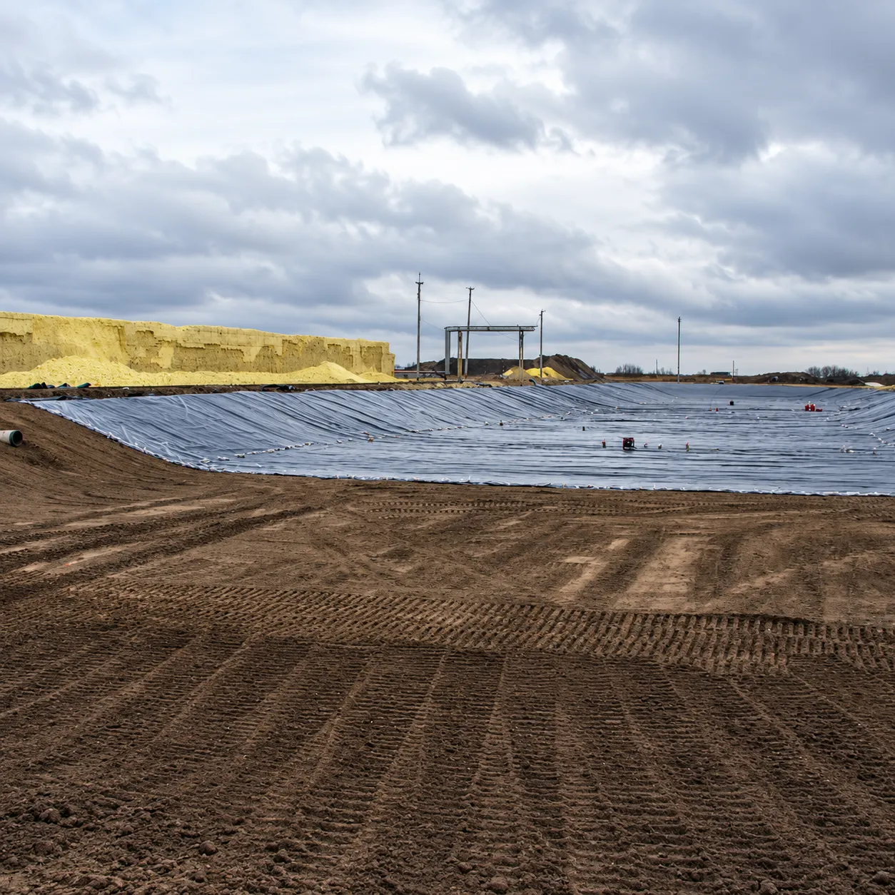 Completed lined containment area at an environmental construction site