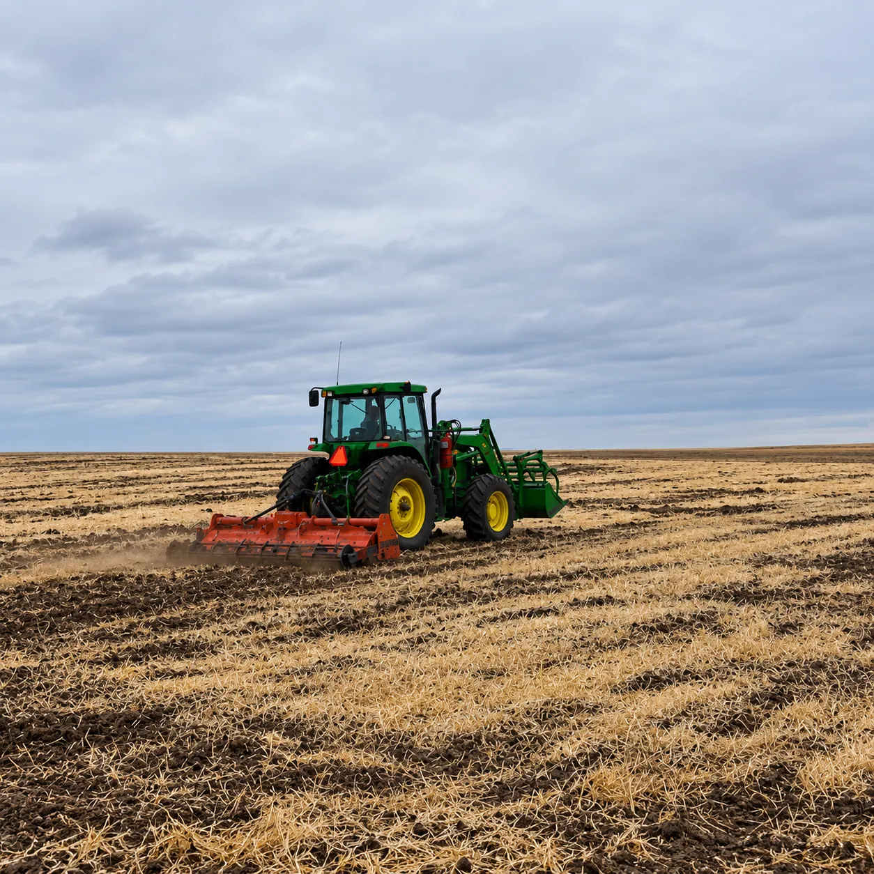Tractor working on re-vegetation and soil restoration