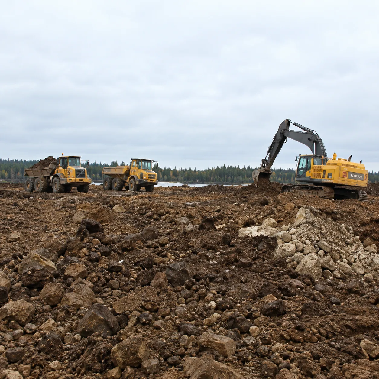 Excavator and heavy equipment performing lease site earthworks