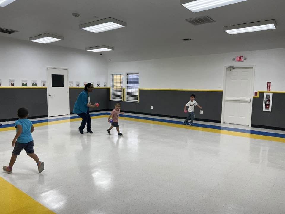 Children engaged in child-led Montessori learning at Kingsbridge Montessori