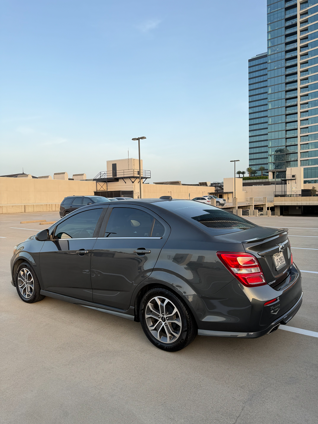 Grey Volvo after ceramic coating, Houston skyline