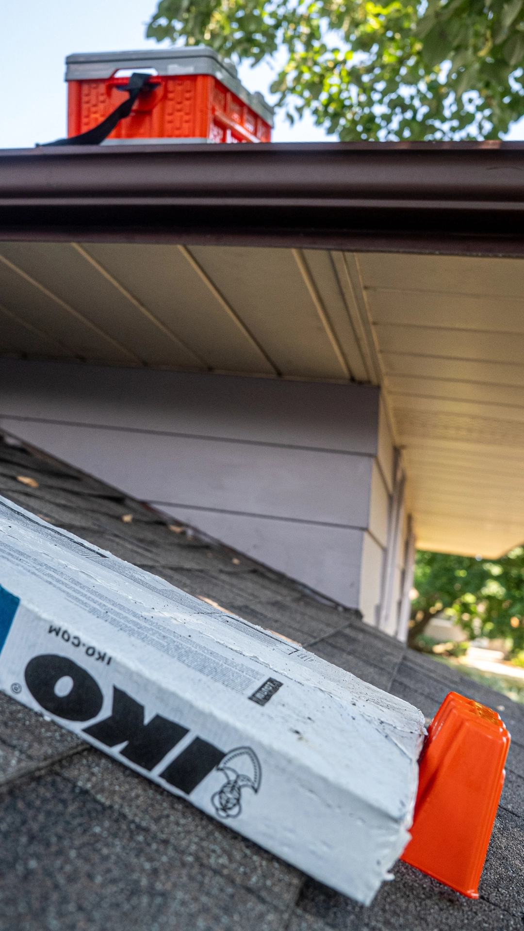 BMF Roofing Solutions shingle anchor and nail caddy on two level roof