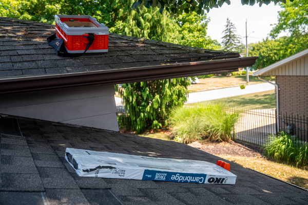 BMF Roofing Solutions shingle anchor and nail caddy on a multi level roof