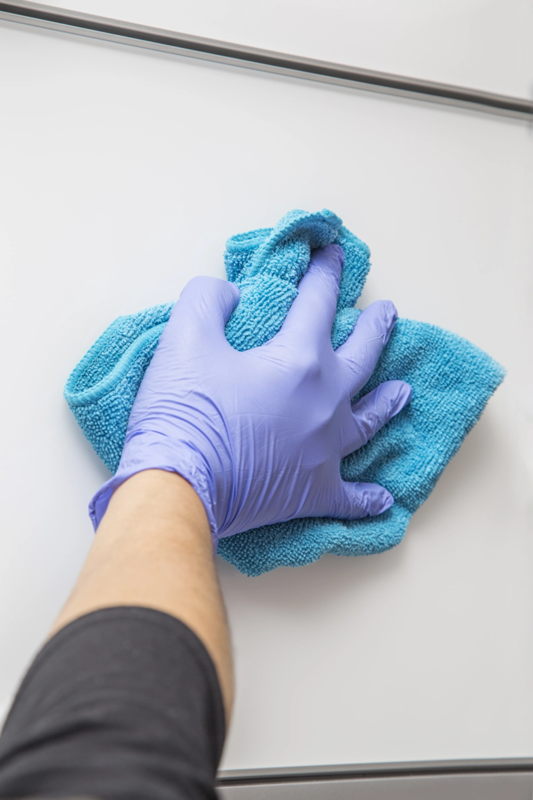 wiping down counter for a cleaning service in new rochelle