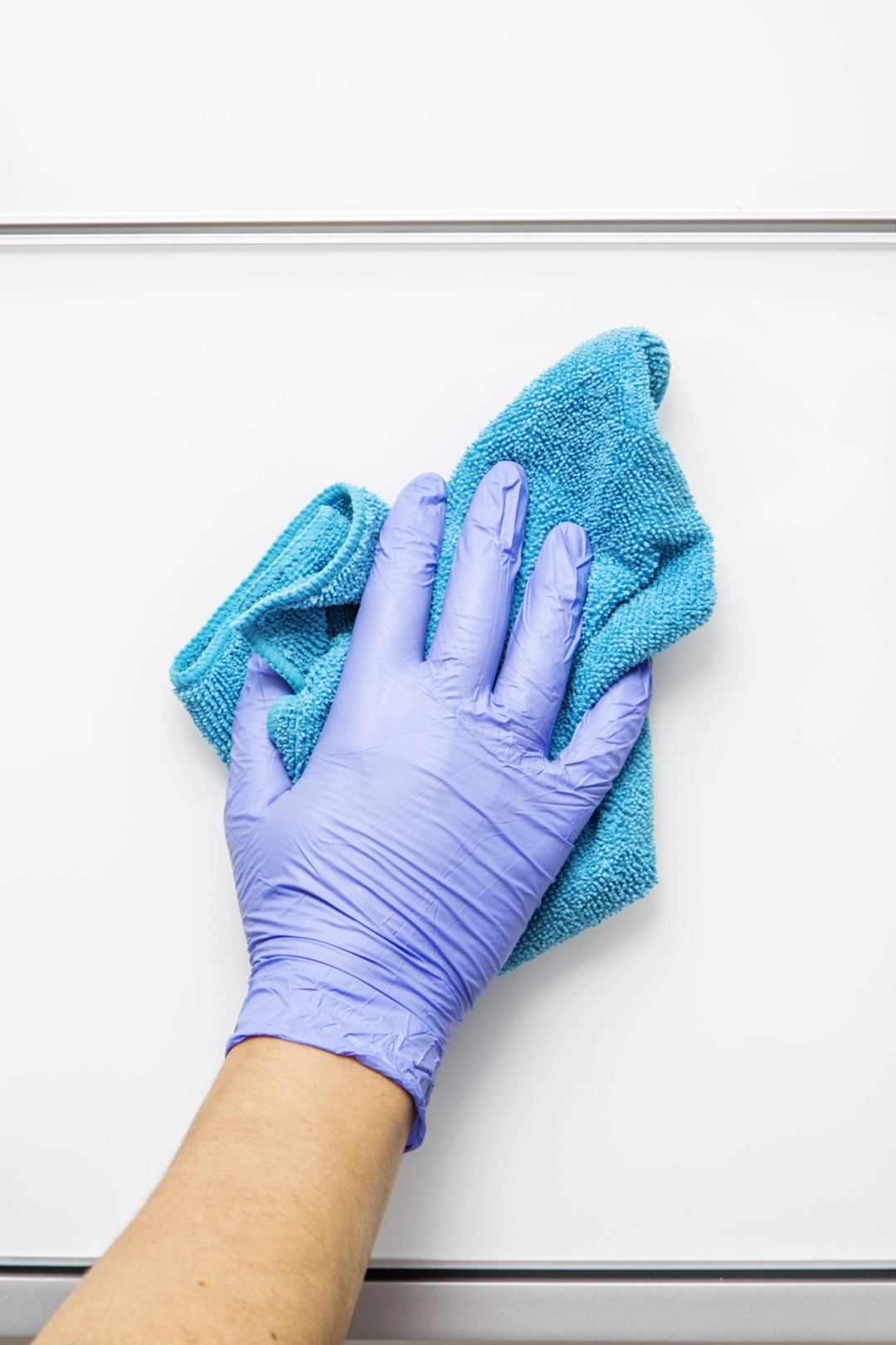 wiping down a cabinet for cleaning in new york and new jersey