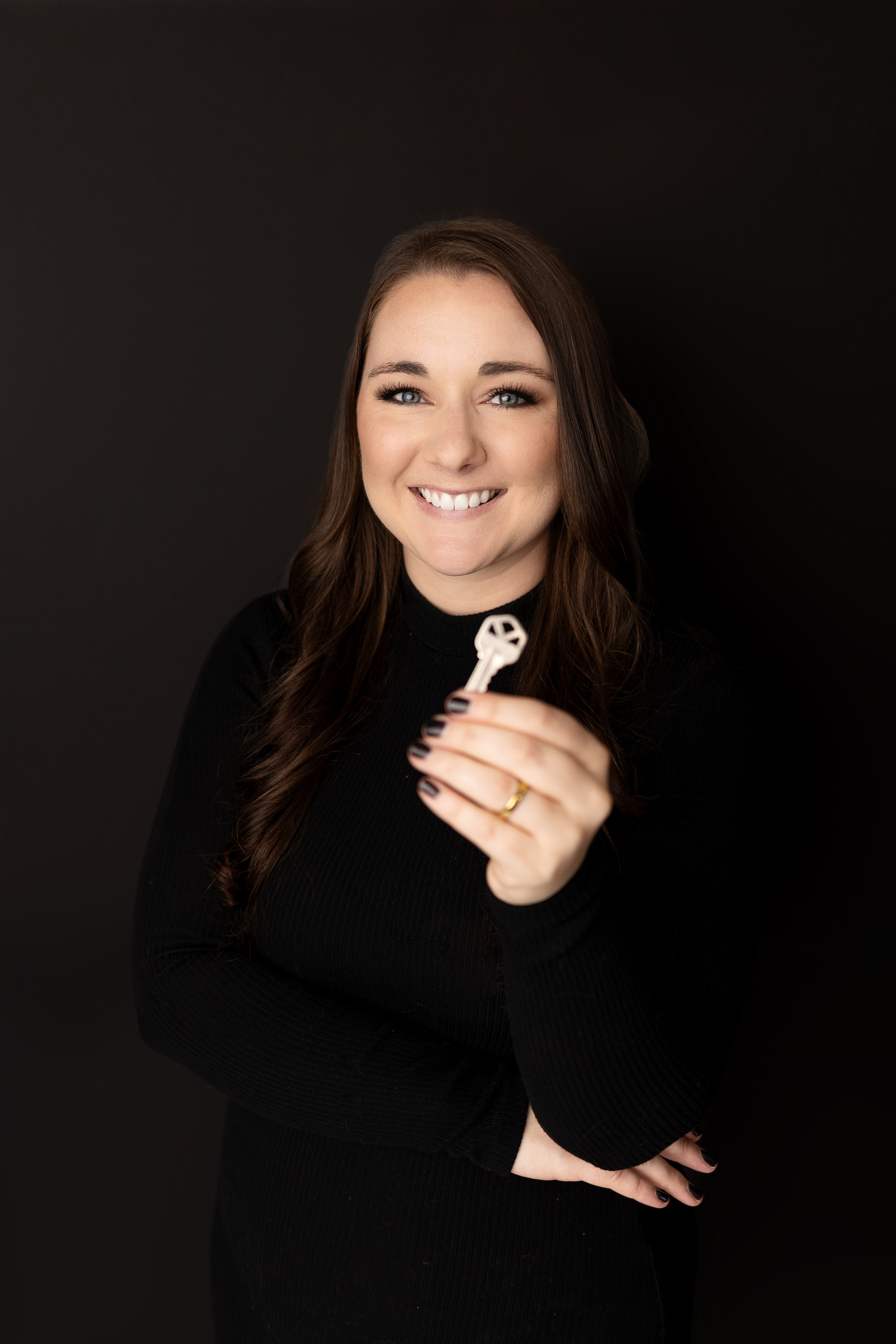 Samantha Van de Roovaart holding a key