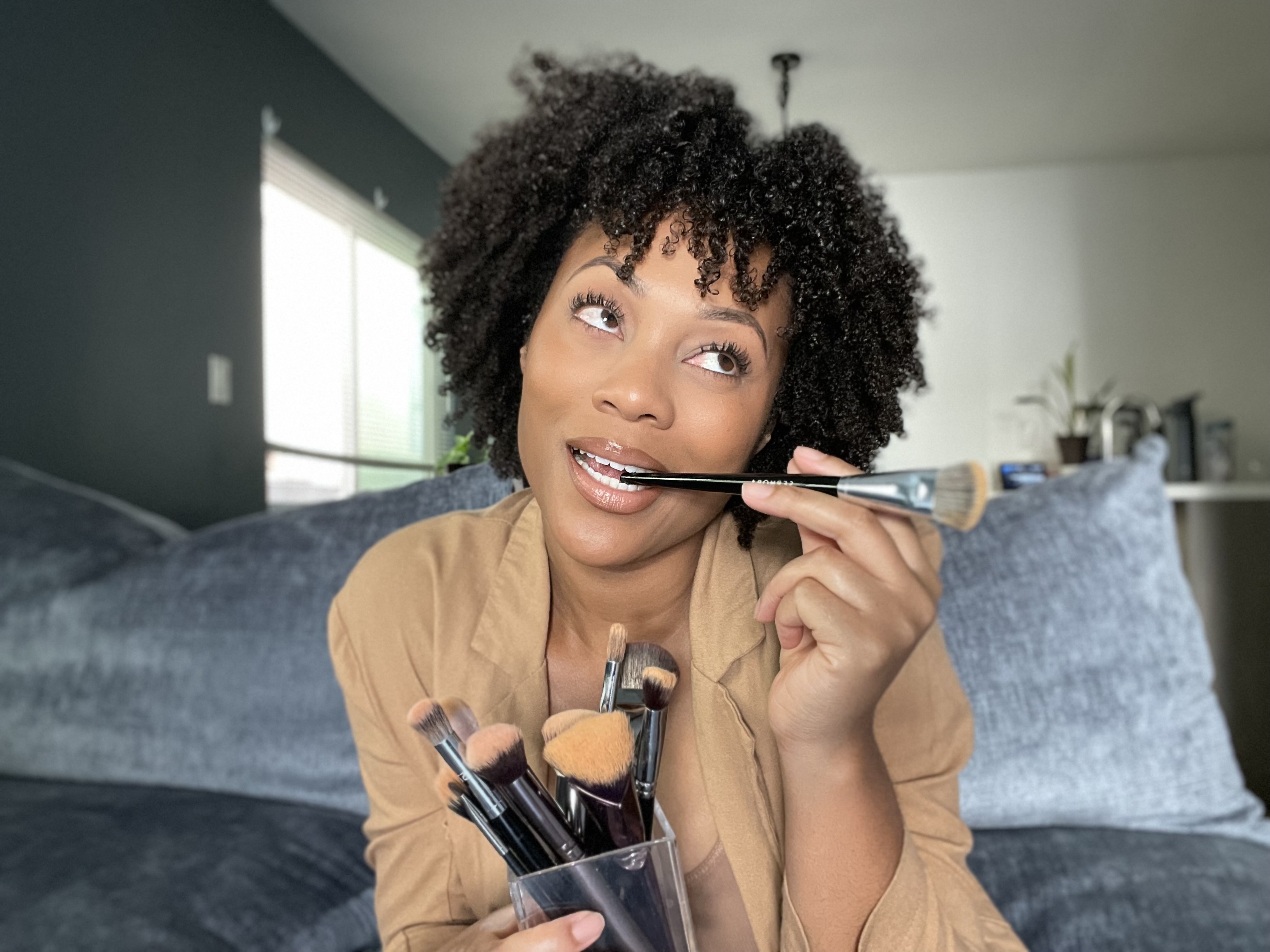 Makeup Artist holding makeup brushes Makeup Artist holding makeup brushes