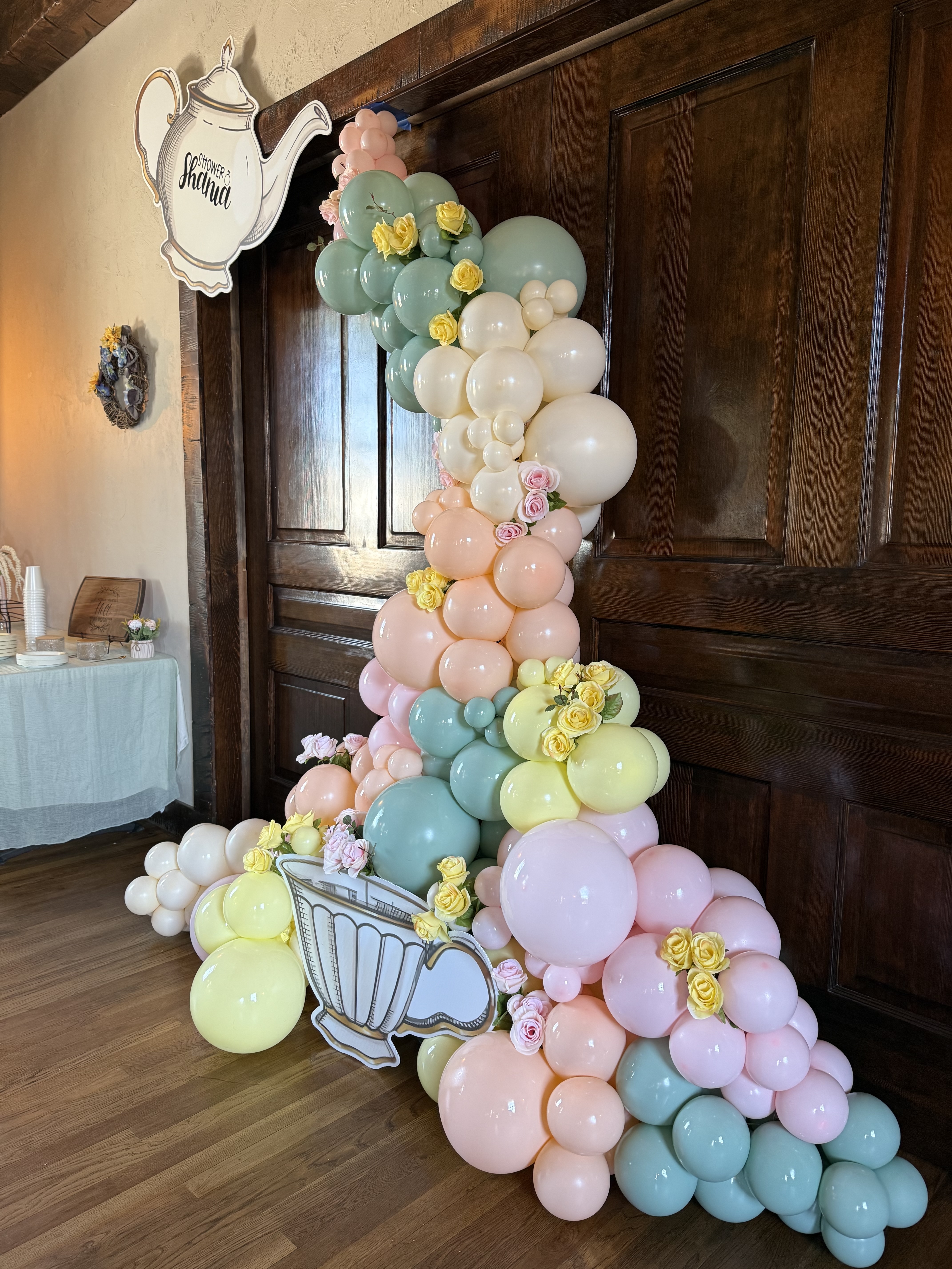 Teapot themed balloon cascade with florals