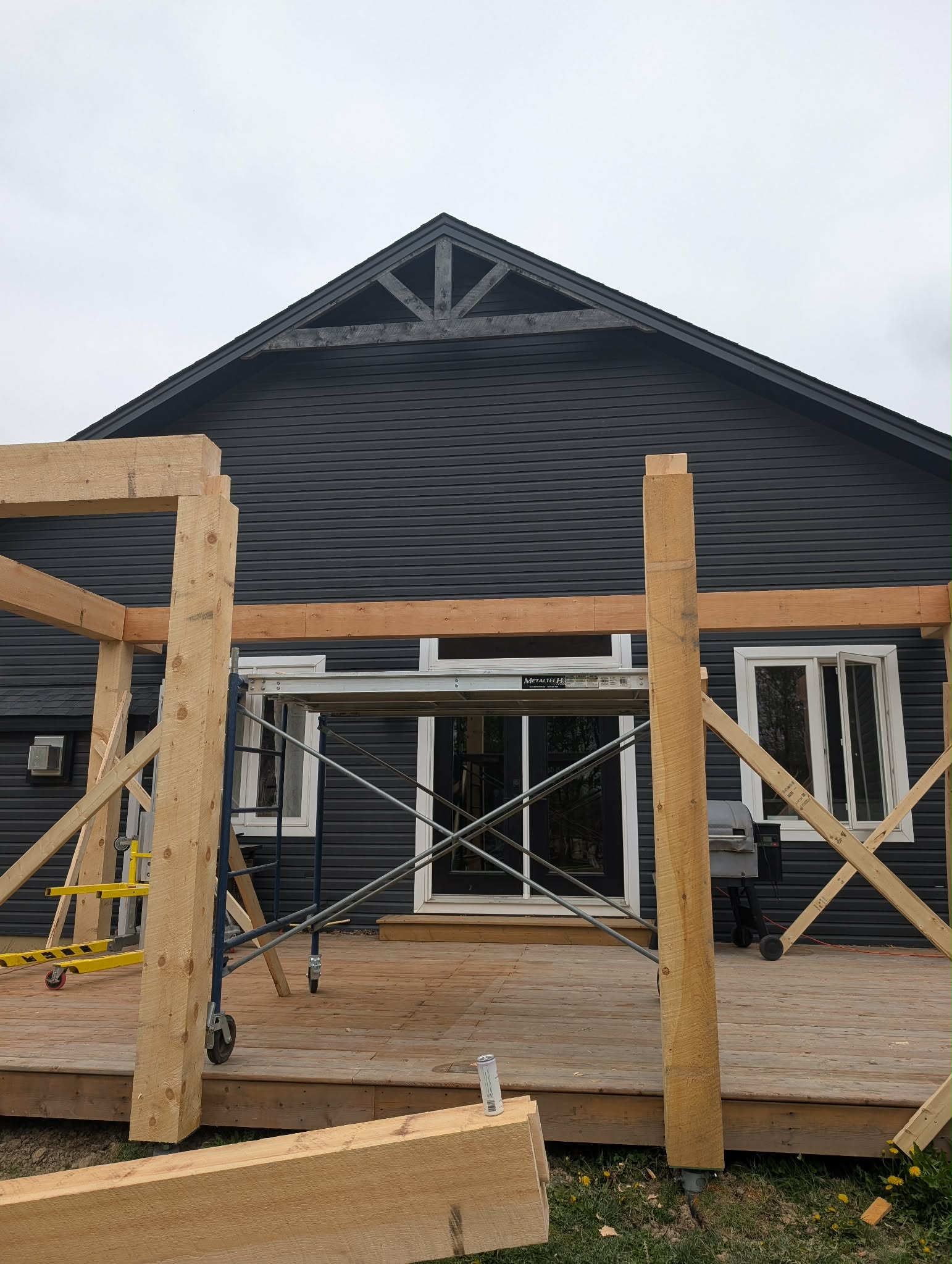Custom 8x8 adjustable saddle installed on helical pile for timber frame deck foundation