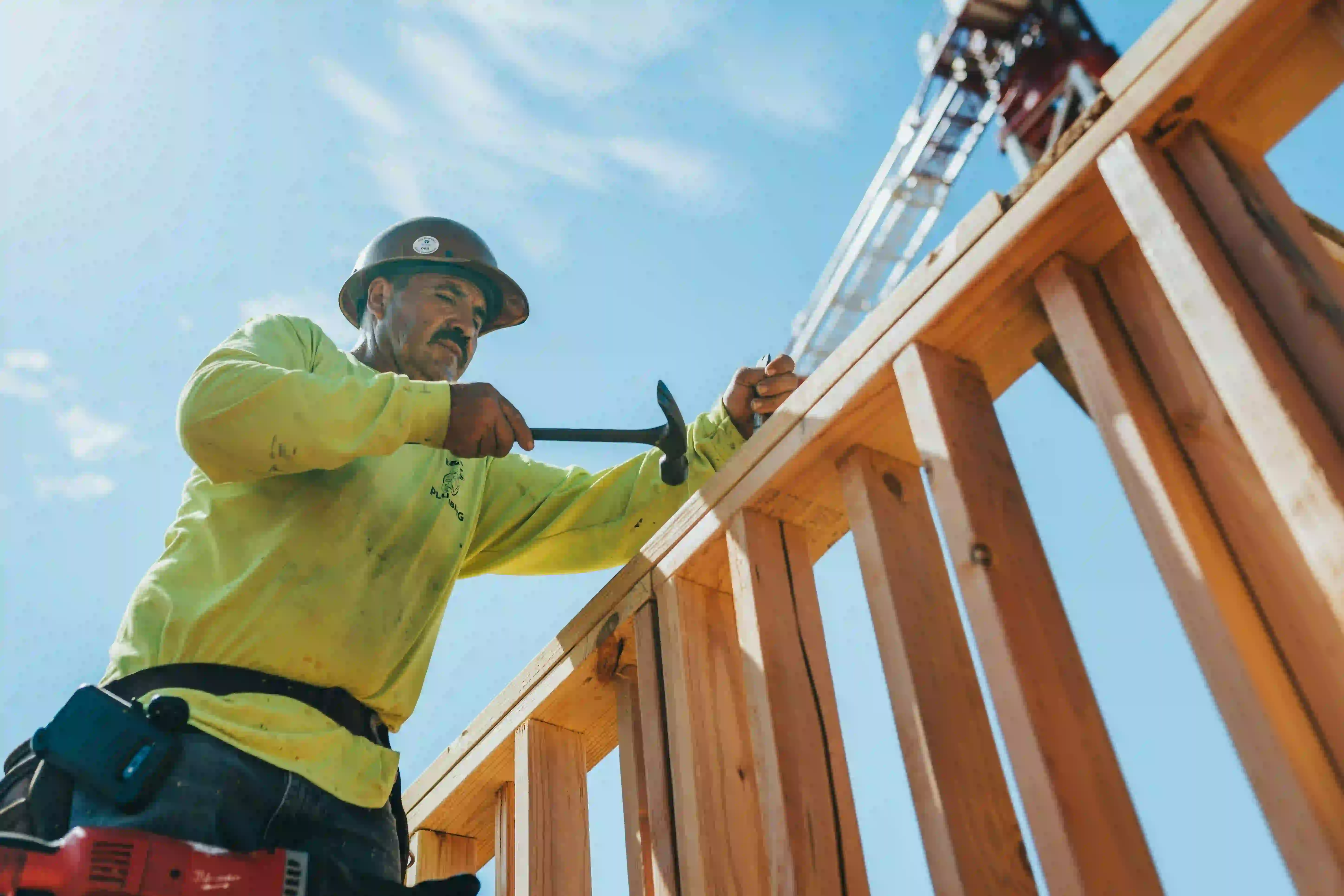 Hamilton-area construction professional framing a structure