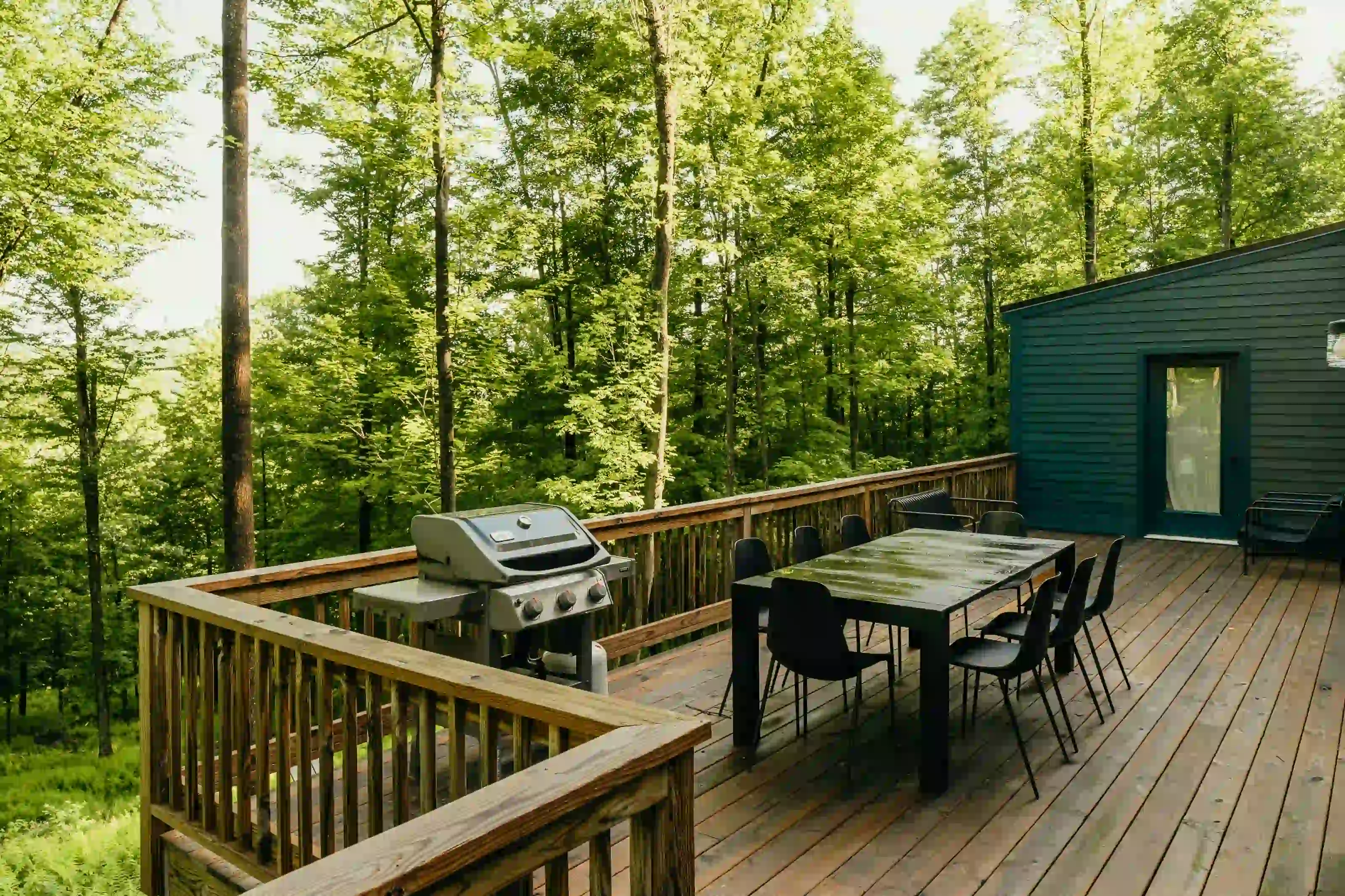 Completed outdoor deck surrounded by Southern Ontario woodland