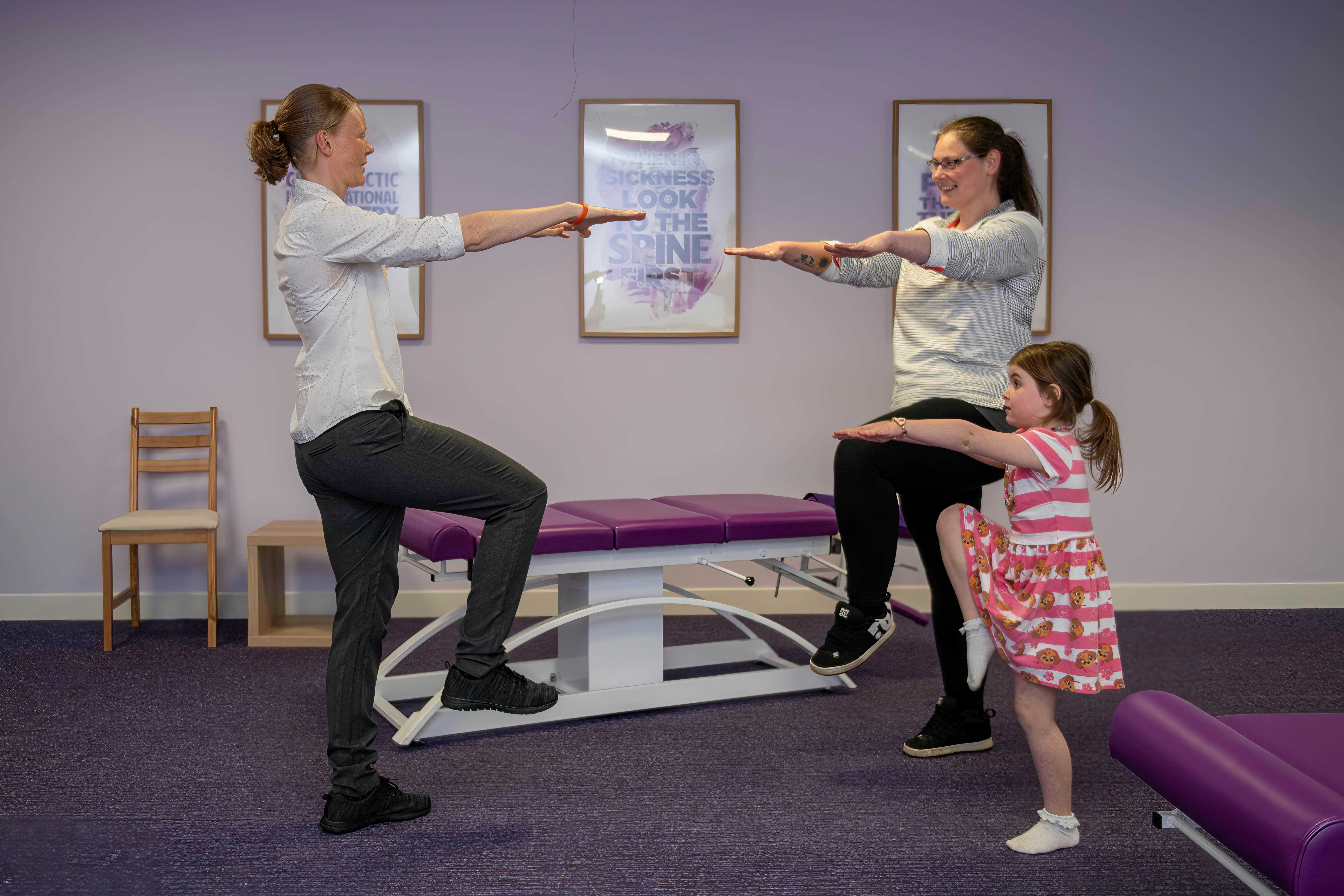 Laura with and adult patient and child  