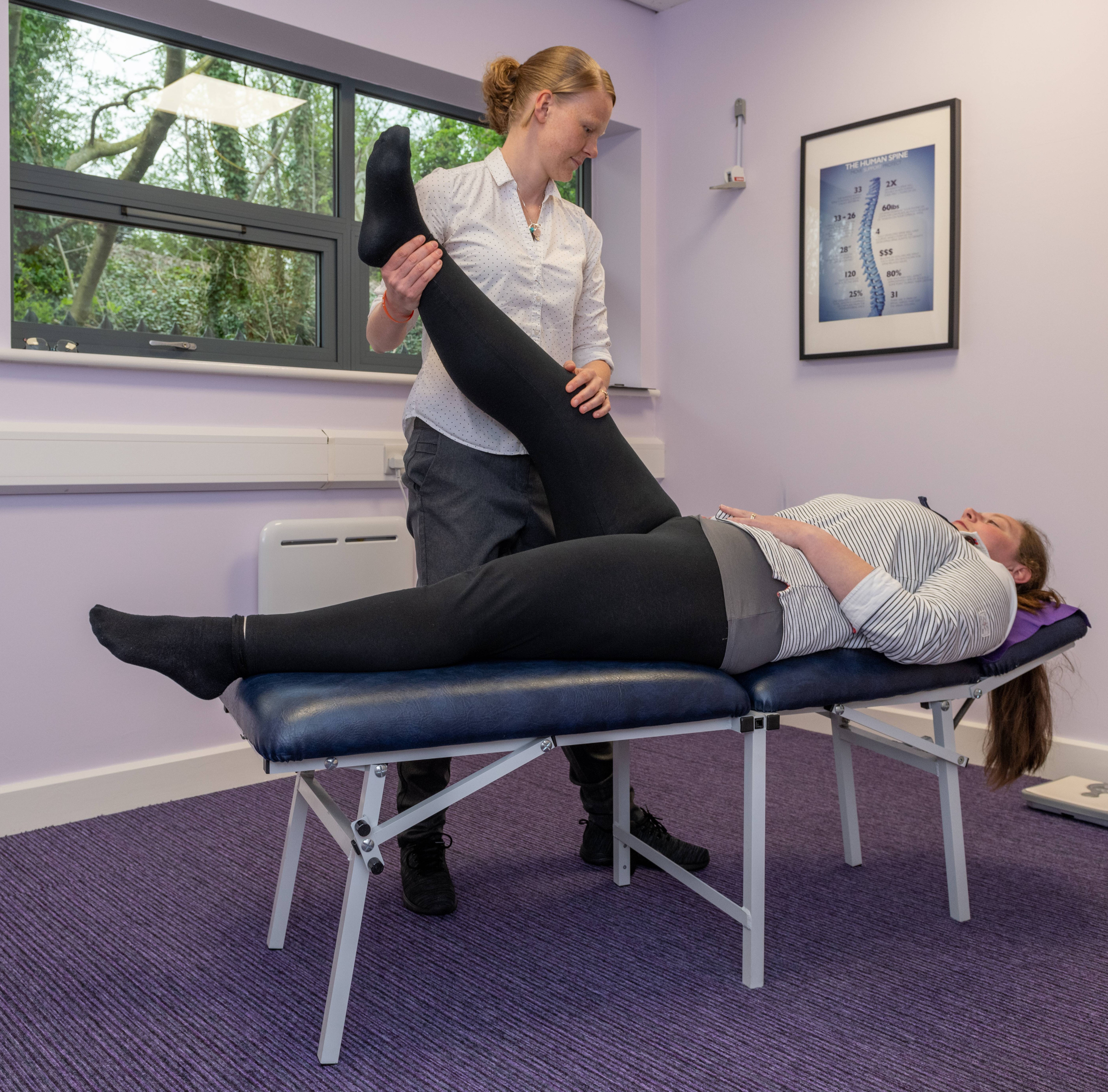 Laura examining patient at a consultation 