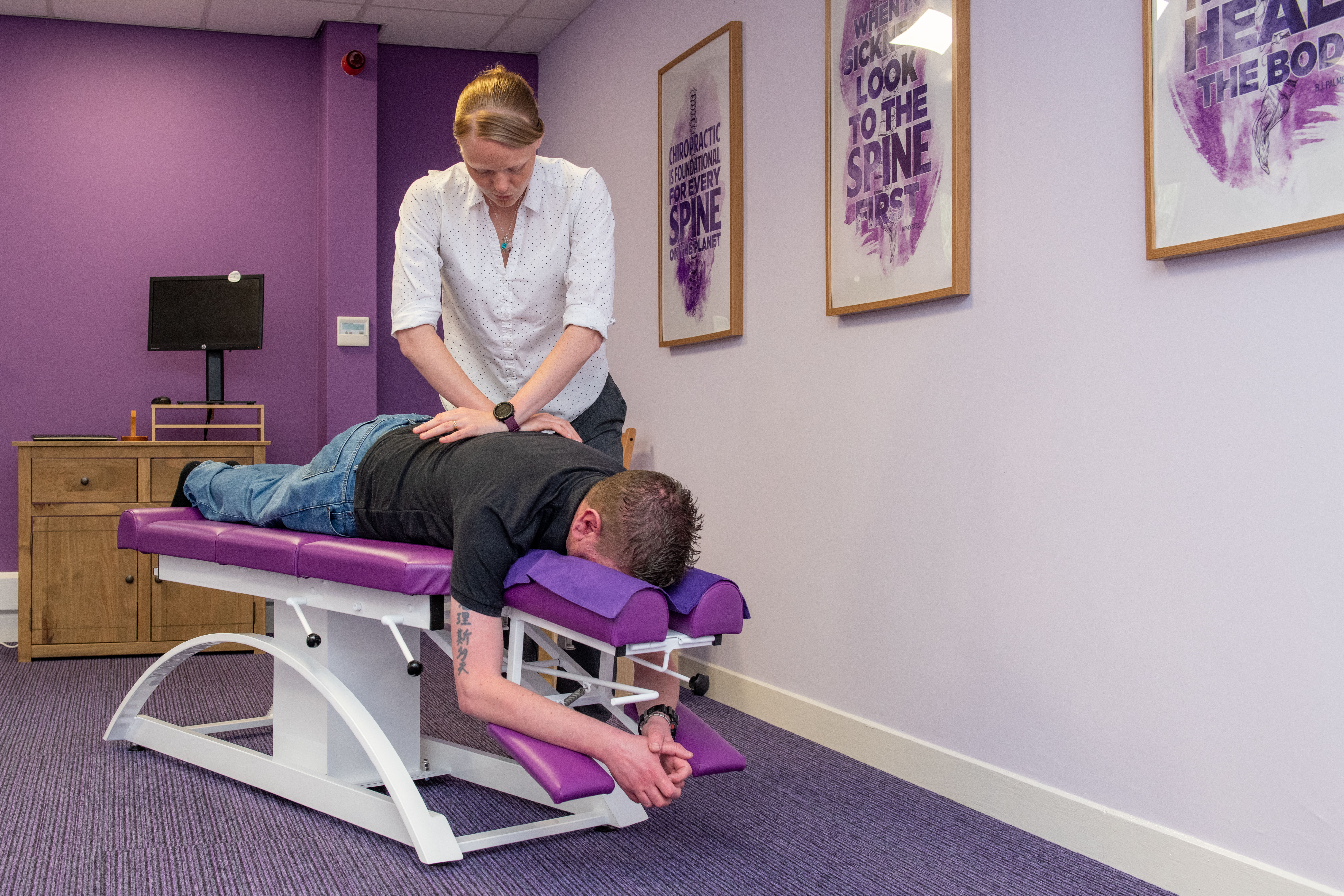 Laura and patient during an adjustment/treatment