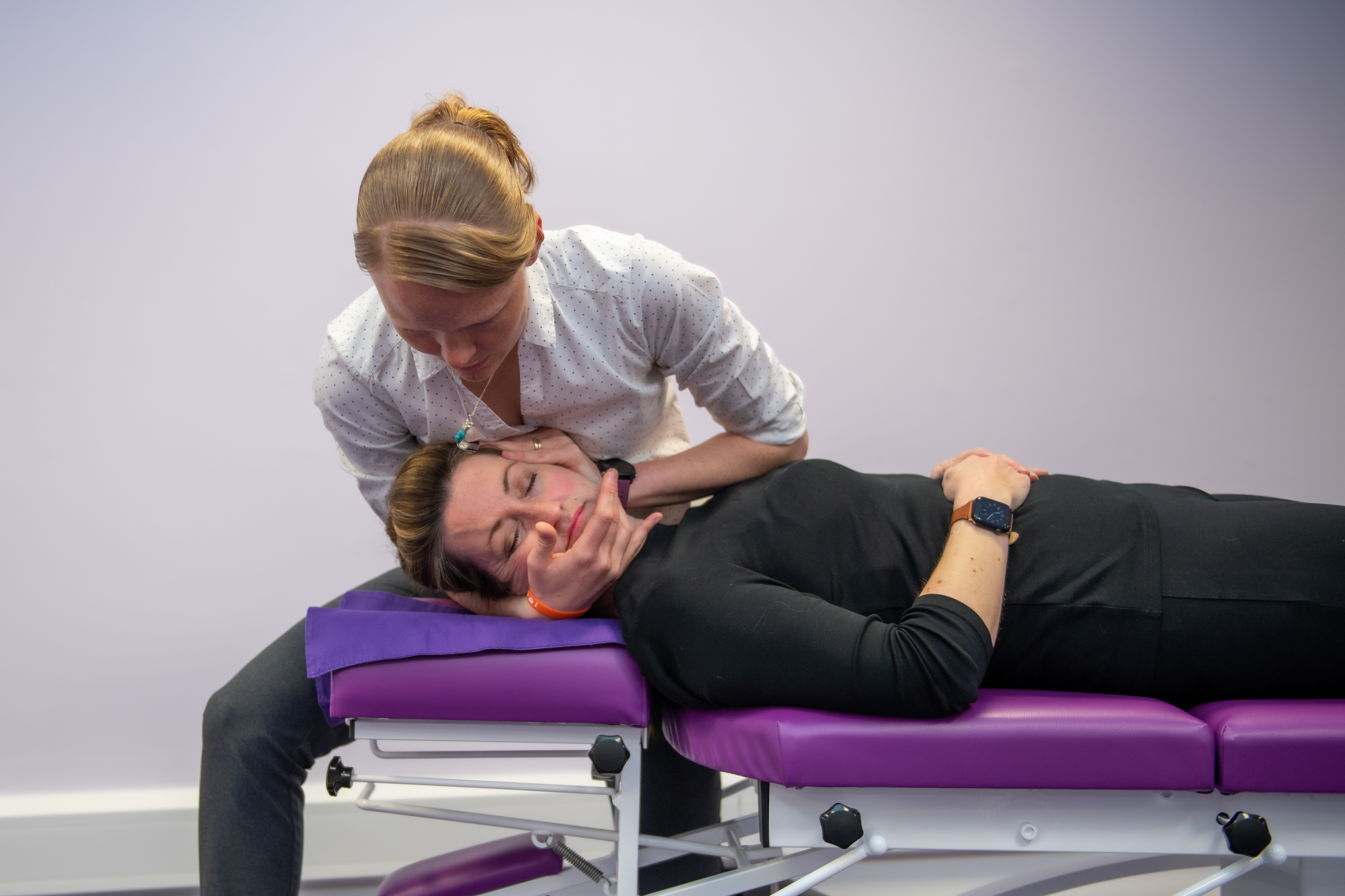Laura and patient during an adjustment/treatment