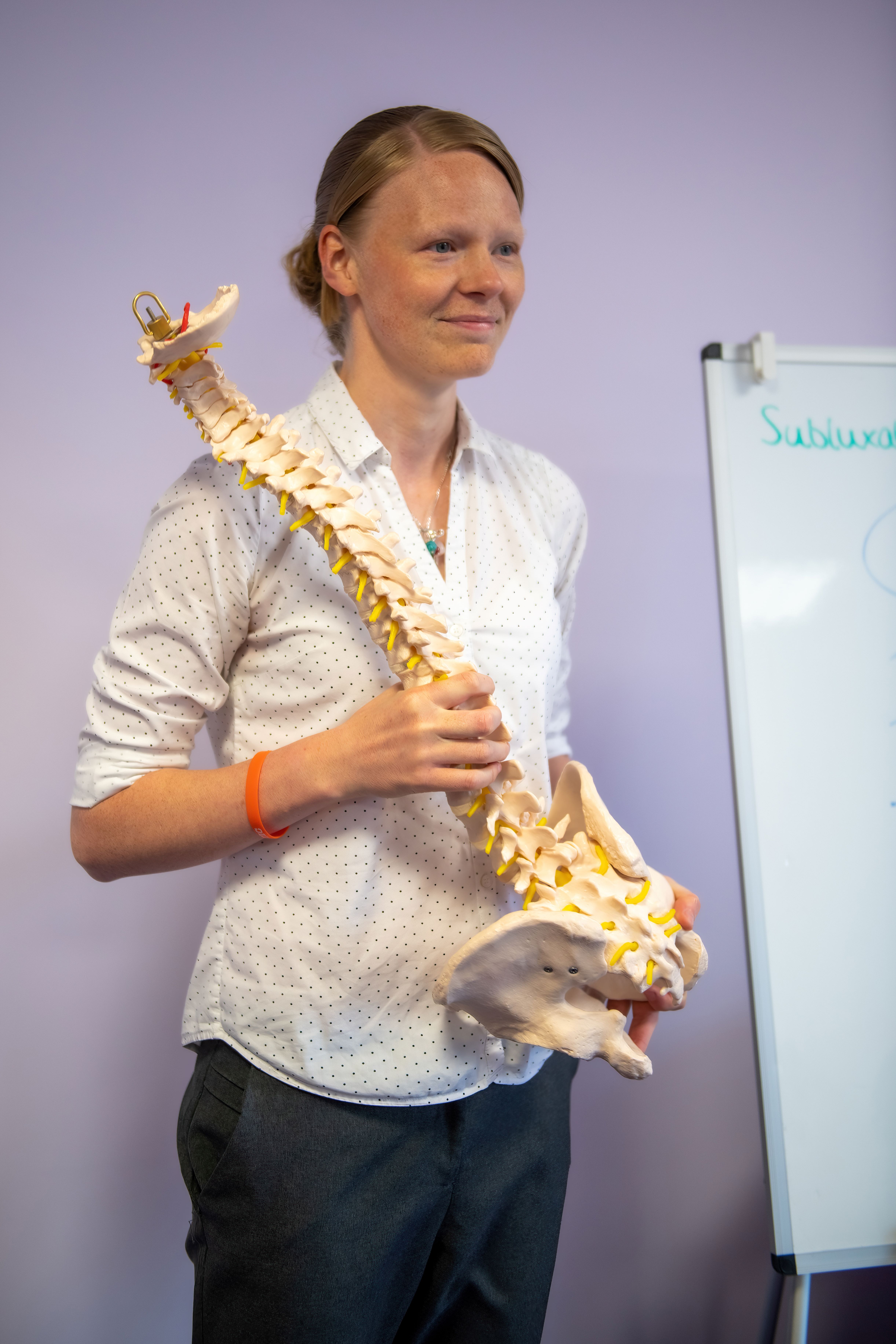 Laura holding a spine