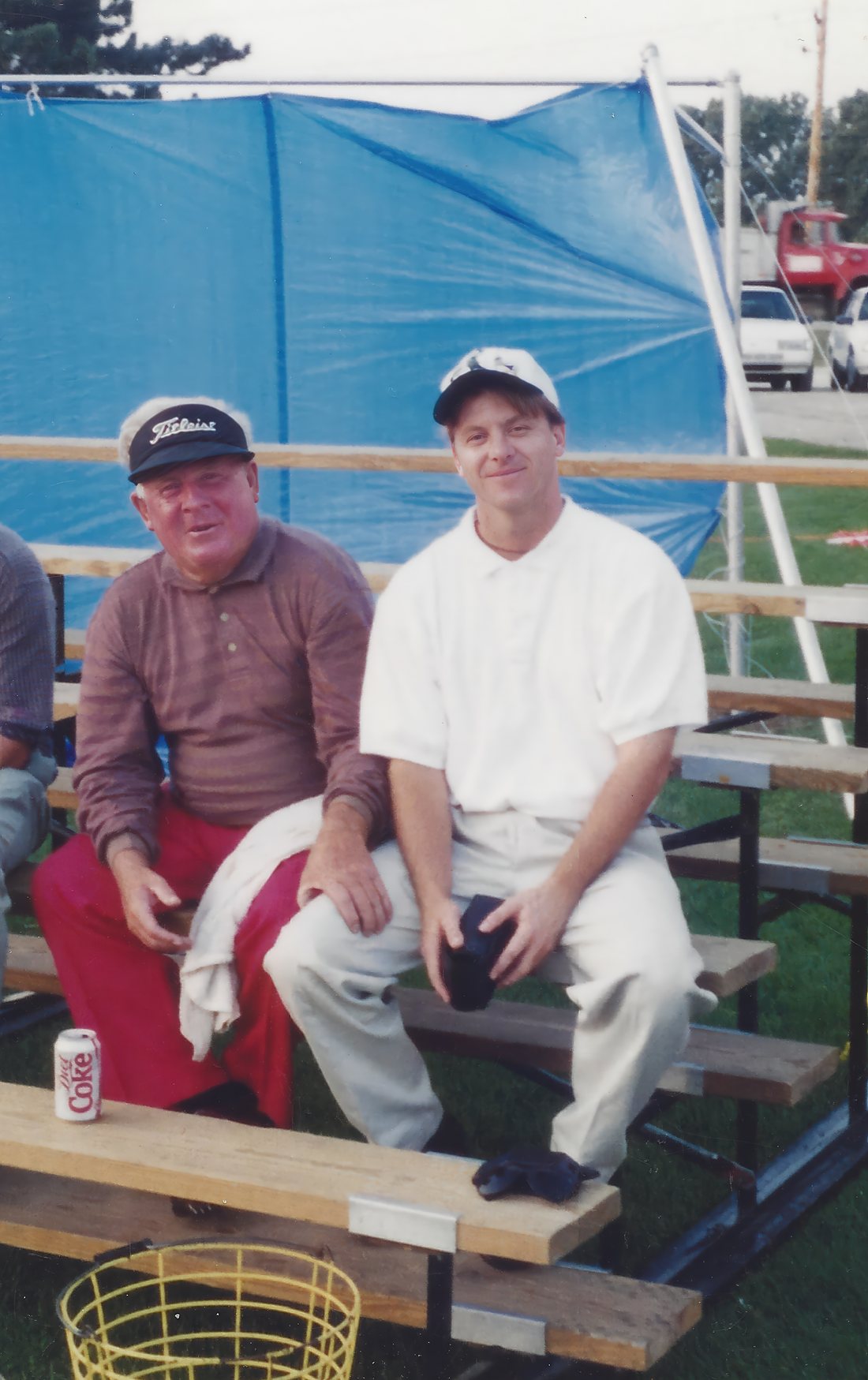 Moe Norman and a young Todd Graves sitting side by side on the bleachers at a driving range — the first day they met.