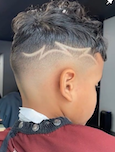 High skin fade with razor line design