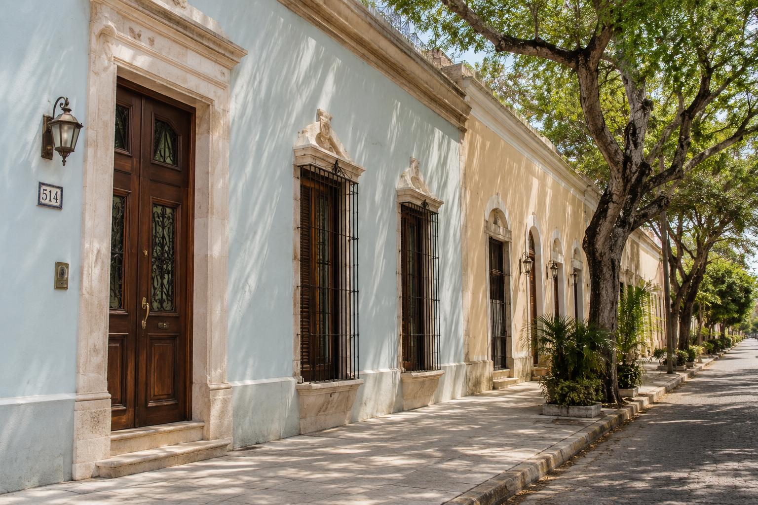 Restored colonial home facade on a quiet tree-shaded Merida street