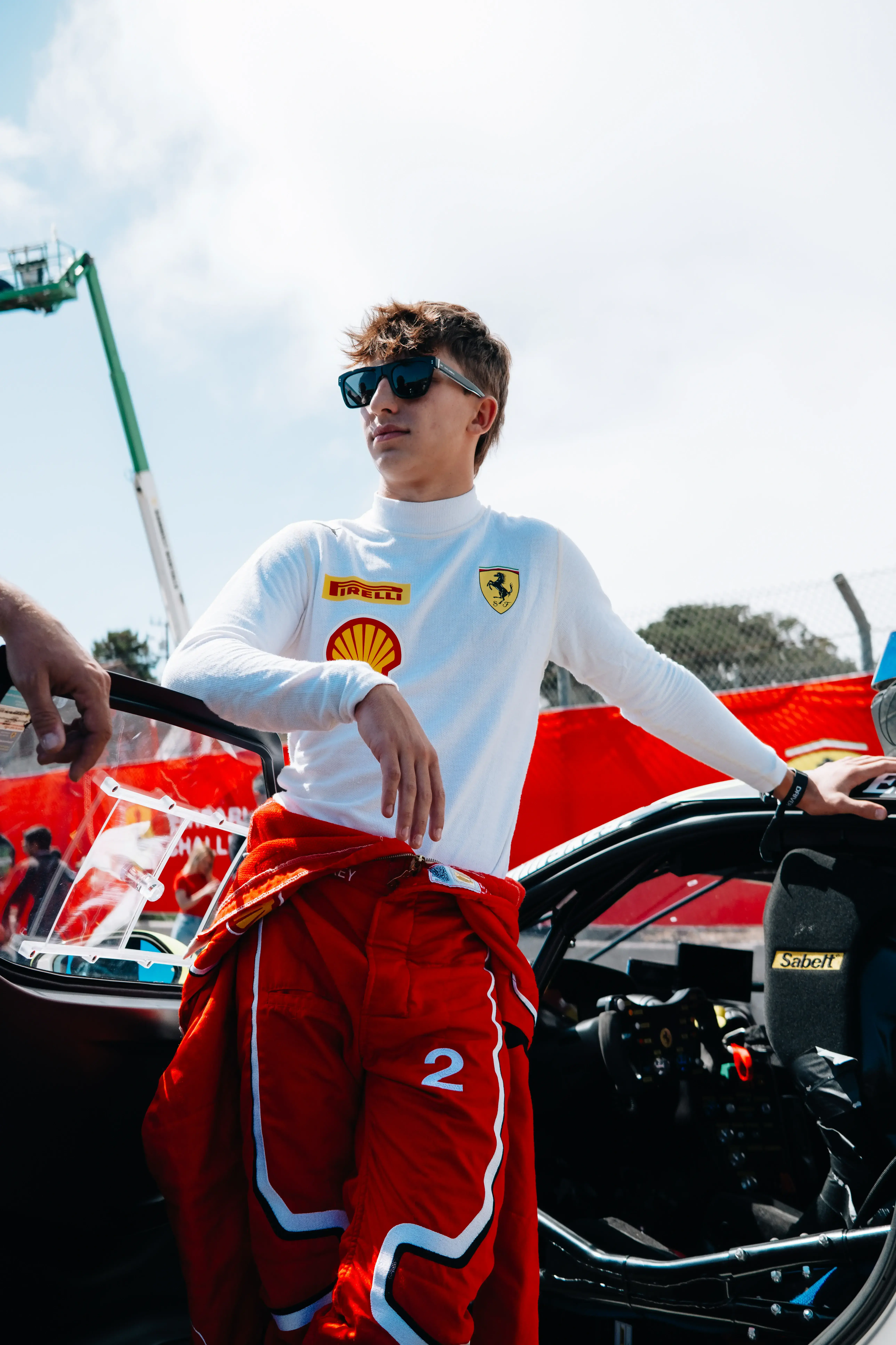 Johnny Kaminskey with his Ferrari Challenge Car as Youngest Ferrari Challenge Driver Ever